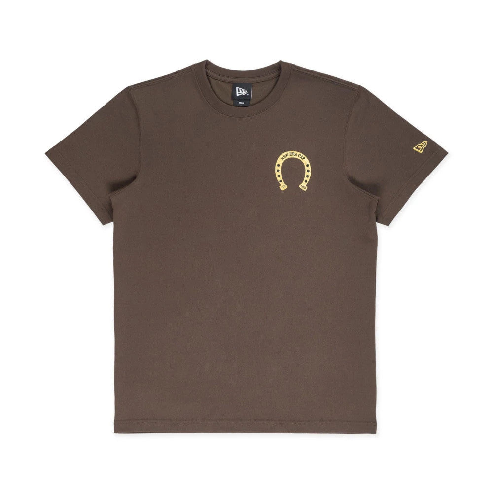 New Era Year Of The Horse Brown T-Shirt, front view showing a brown shirt with a small yellow horseshoe design on the left chest and an embossed New Era logo on the right sleeve near the hem.