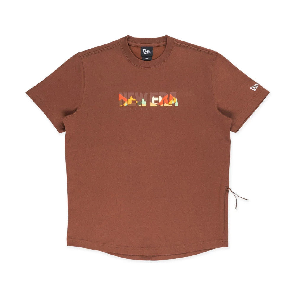 New Era Mountain Logo Open Brown T-Shirt, front view showing a brown short-sleeved shirt with a colourful debossed New Era mountain logo across the chest and a white embroidered New Era logo on the left sleeve.