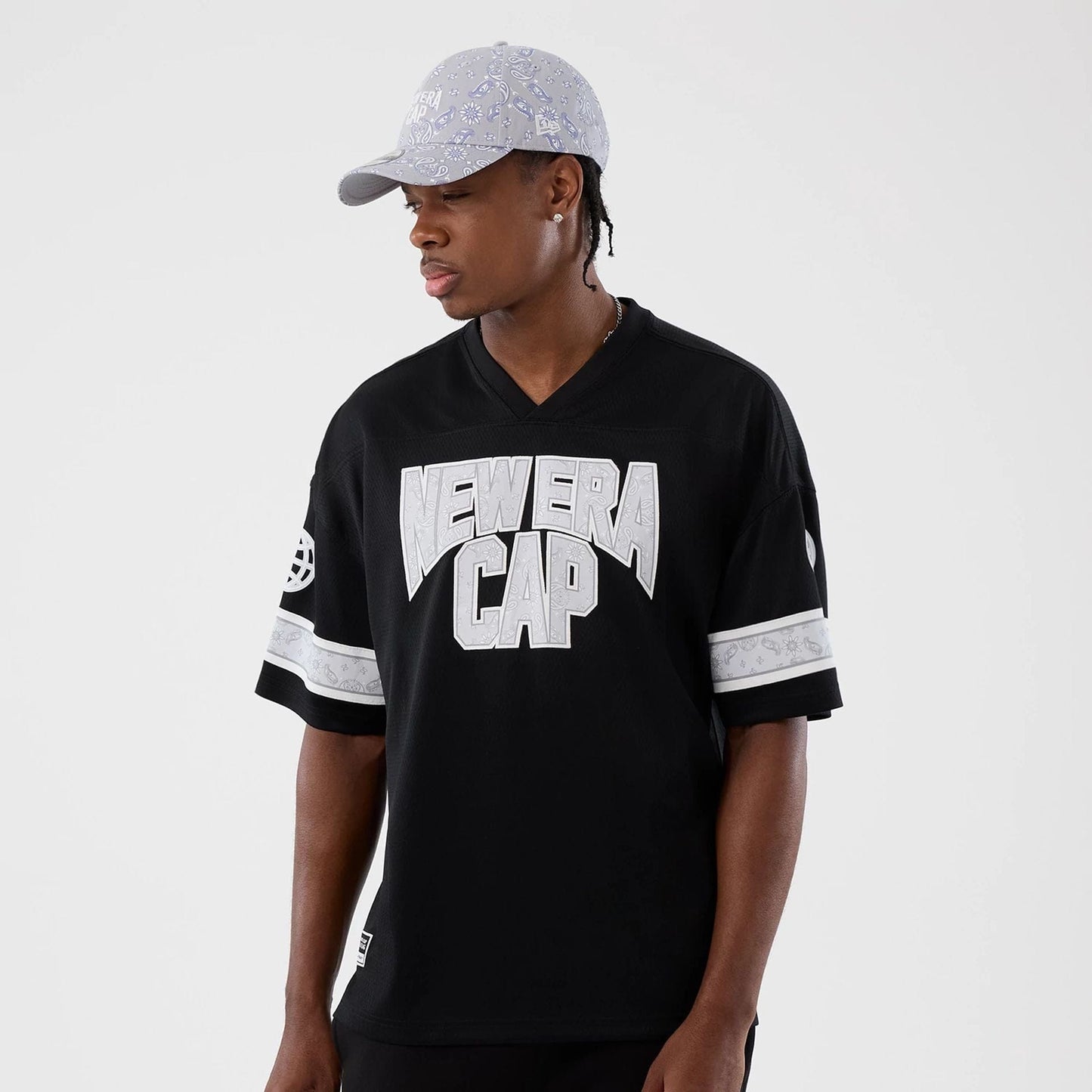 The Male model is wearing New Era Street Swing Black T-Shirt 7