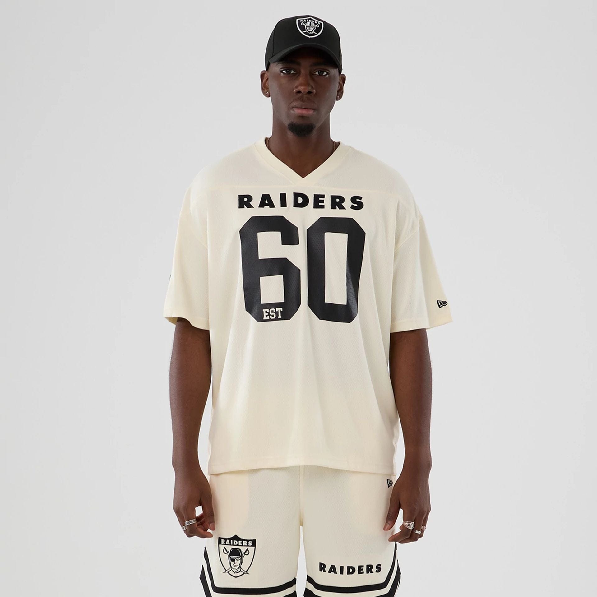 The model is wearing this NFL Historic Las Vegas Raiders Oversized T-Shirt in cream. 1