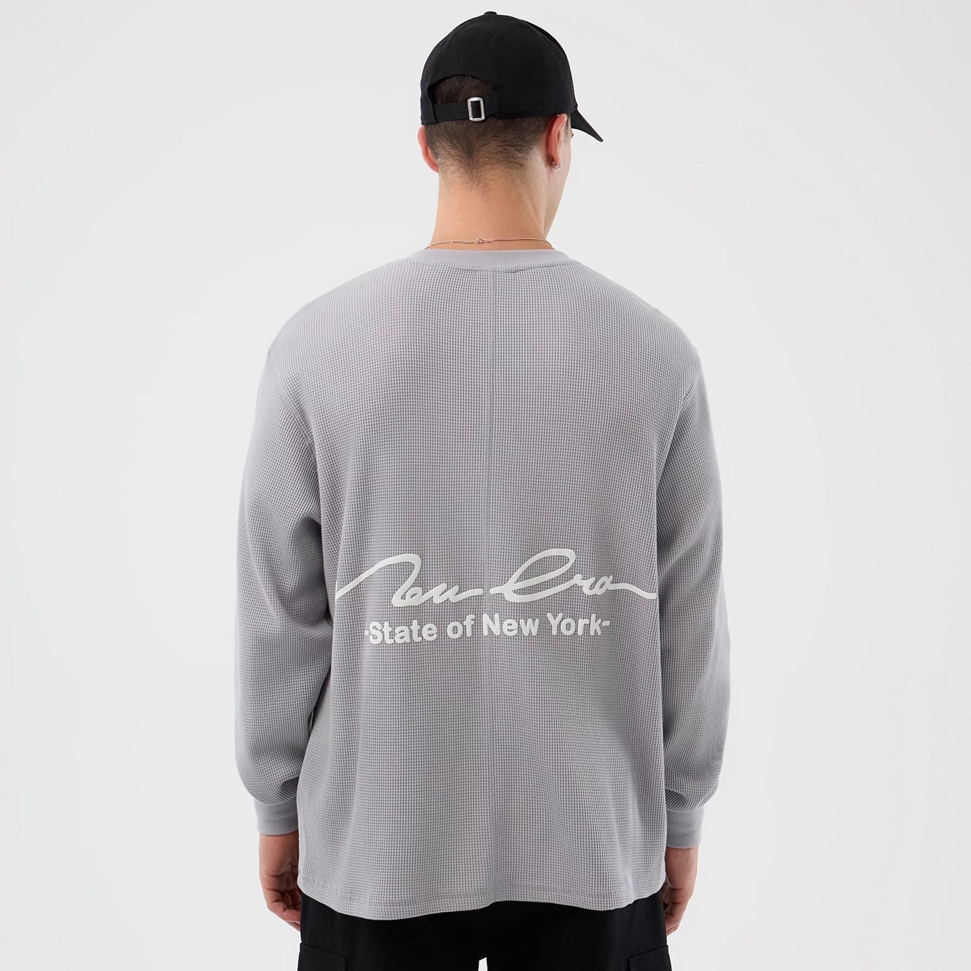 The Male model is wearing New Era Basic Grey Long Sleeve T-Shirt 2