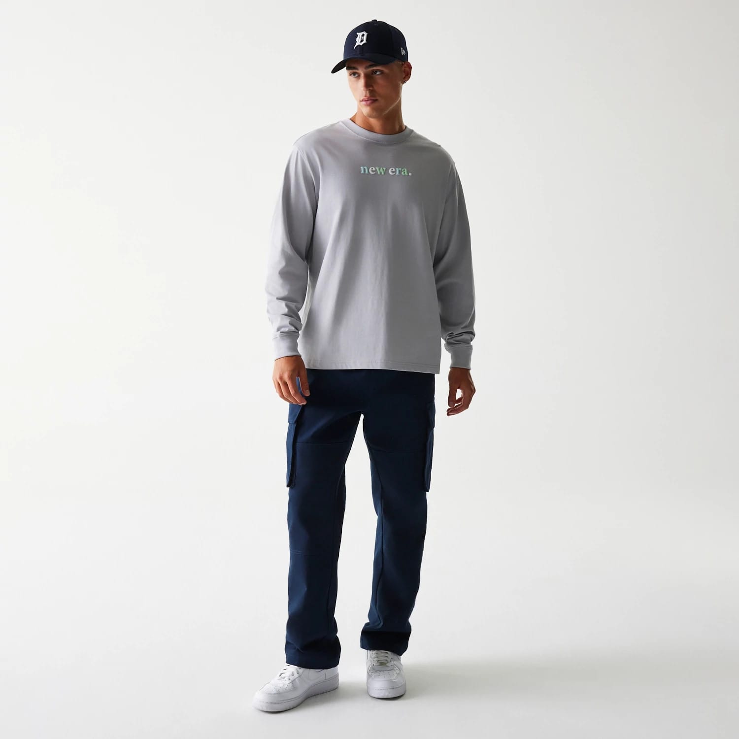 The Male model is wearing New Era 90s Vibe Grey Long Sleeve T-Shirt 3