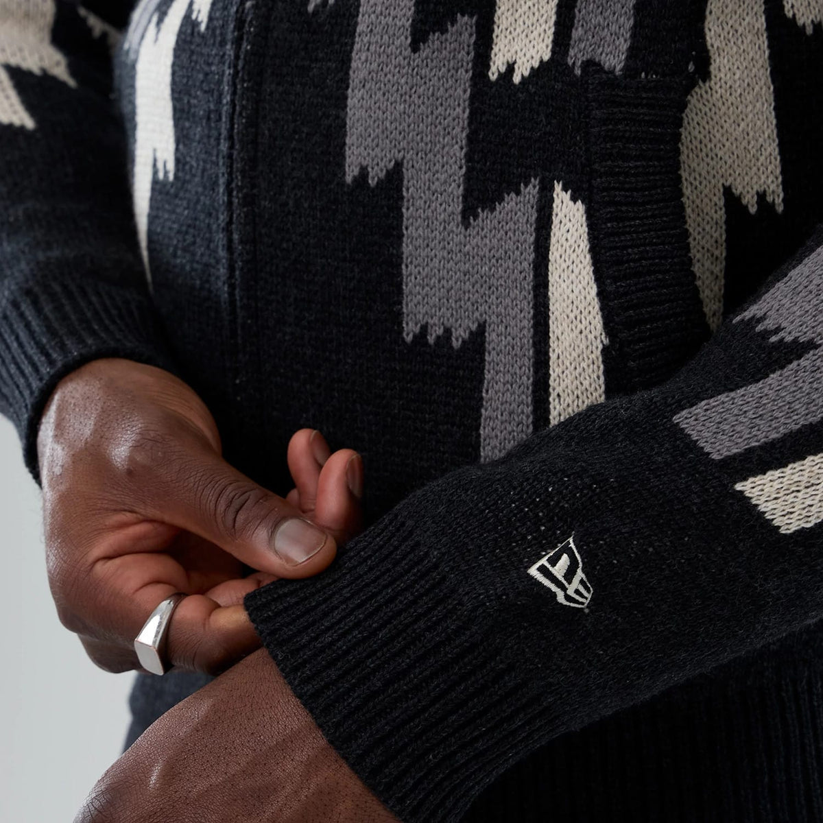 The Male model is wearing New Era Organic Cowichan Black Cardigan 4