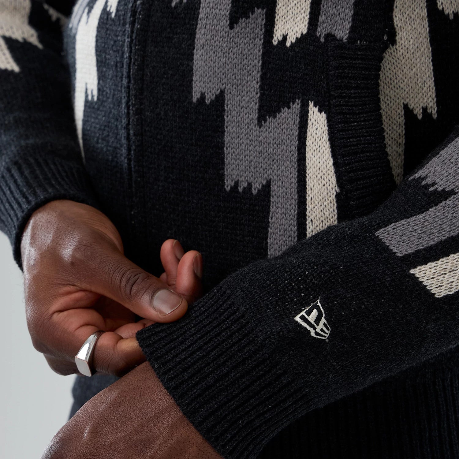 The Male model is wearing New Era Organic Cowichan Black Cardigan 4