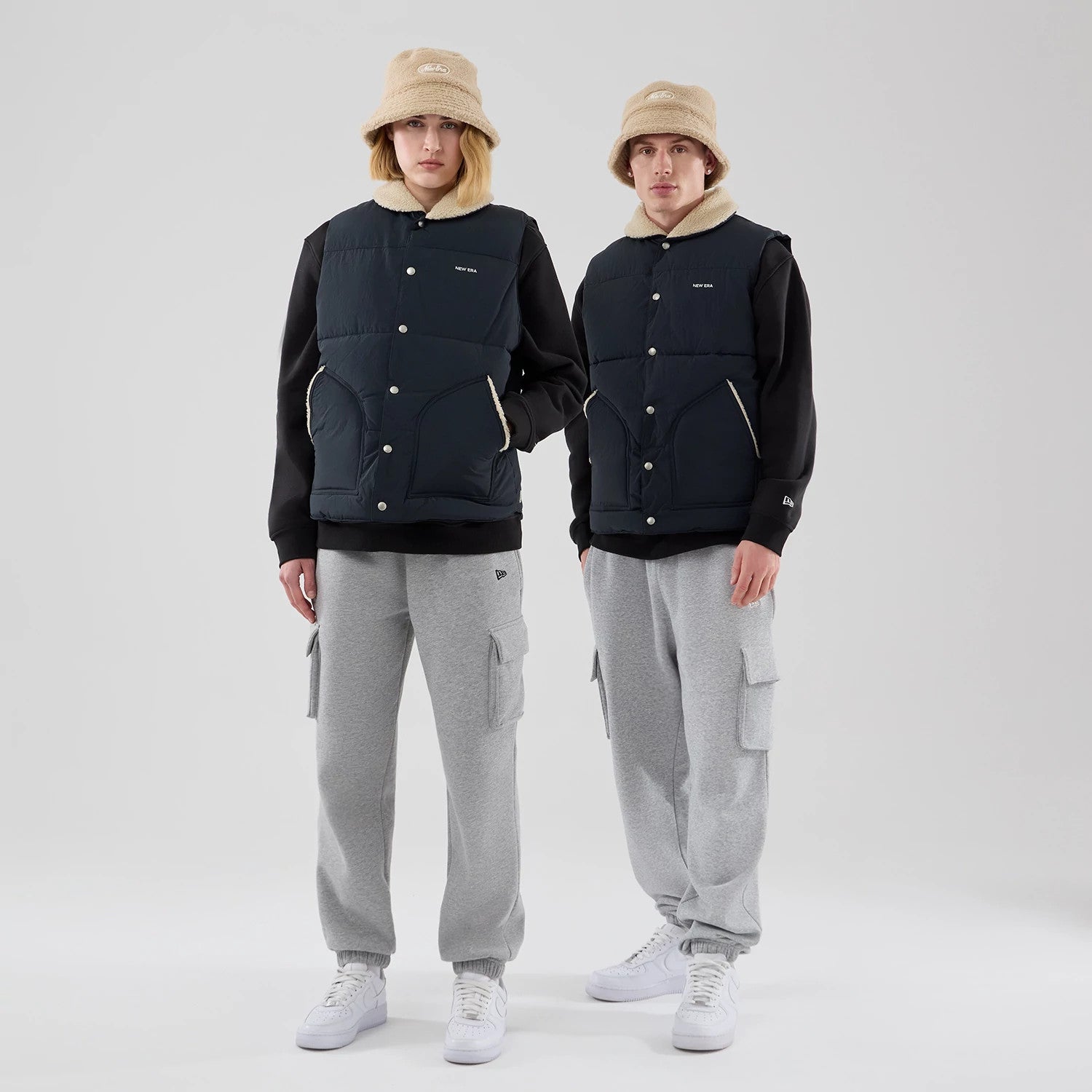 The Male model is wearing New Era Organic Boa Neck Navy Gilet 1