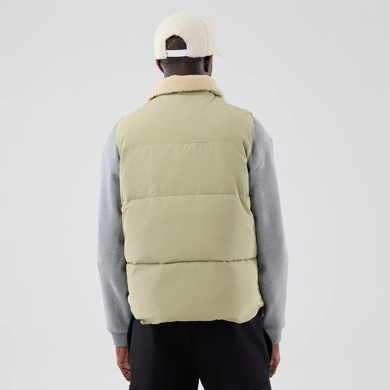 The Male model is wearing New Era Organic Boa Neck Khaki Gilet 2