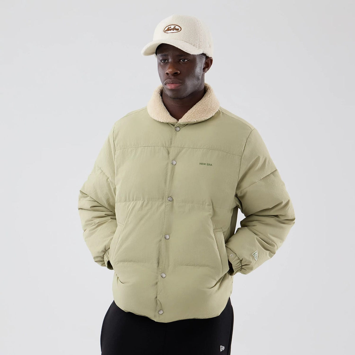The Male model is wearing New Era Organic Boa Neck Khaki Jacket 3