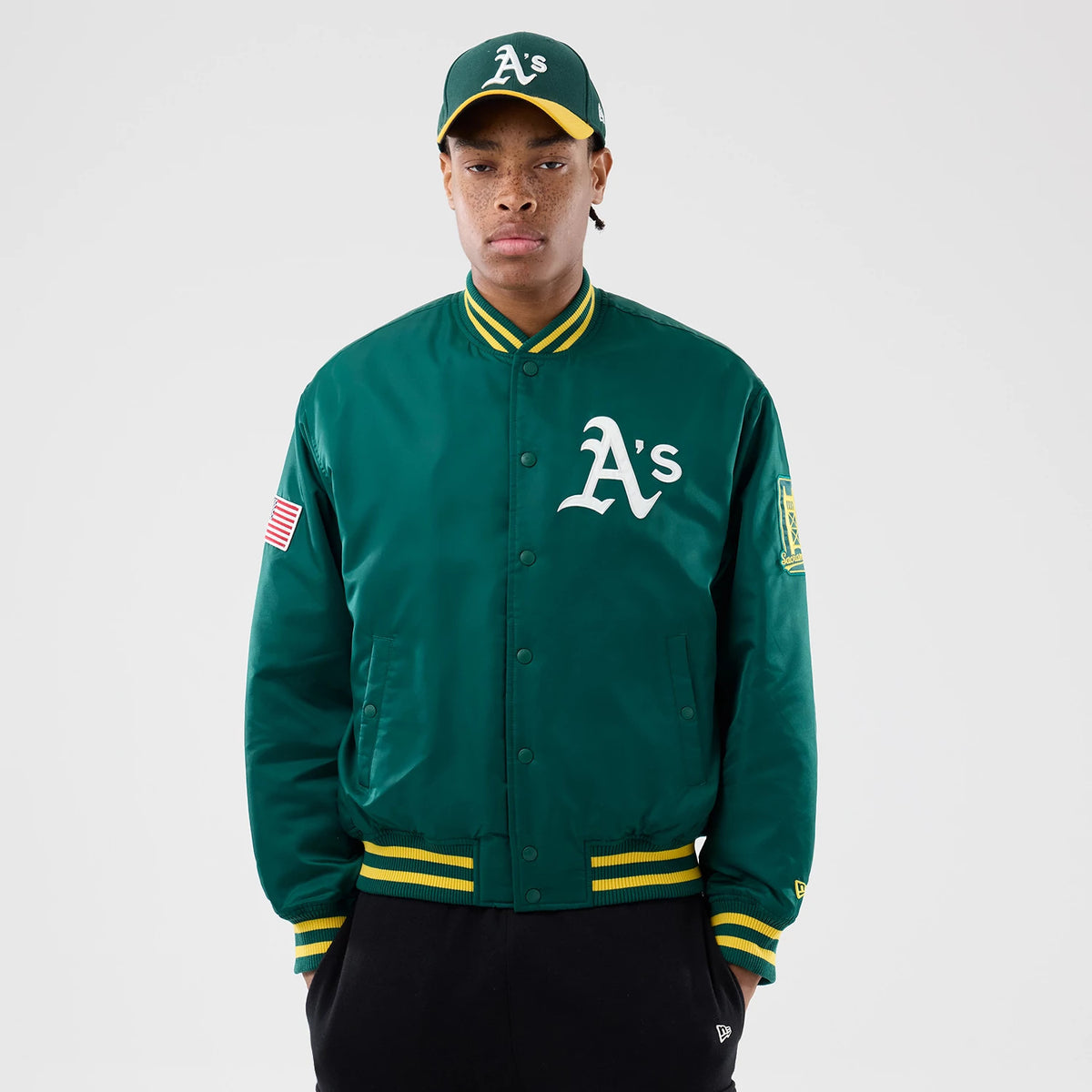 The Male model is wearing Athletics MLB Authentic Green Stadium Jacket 1