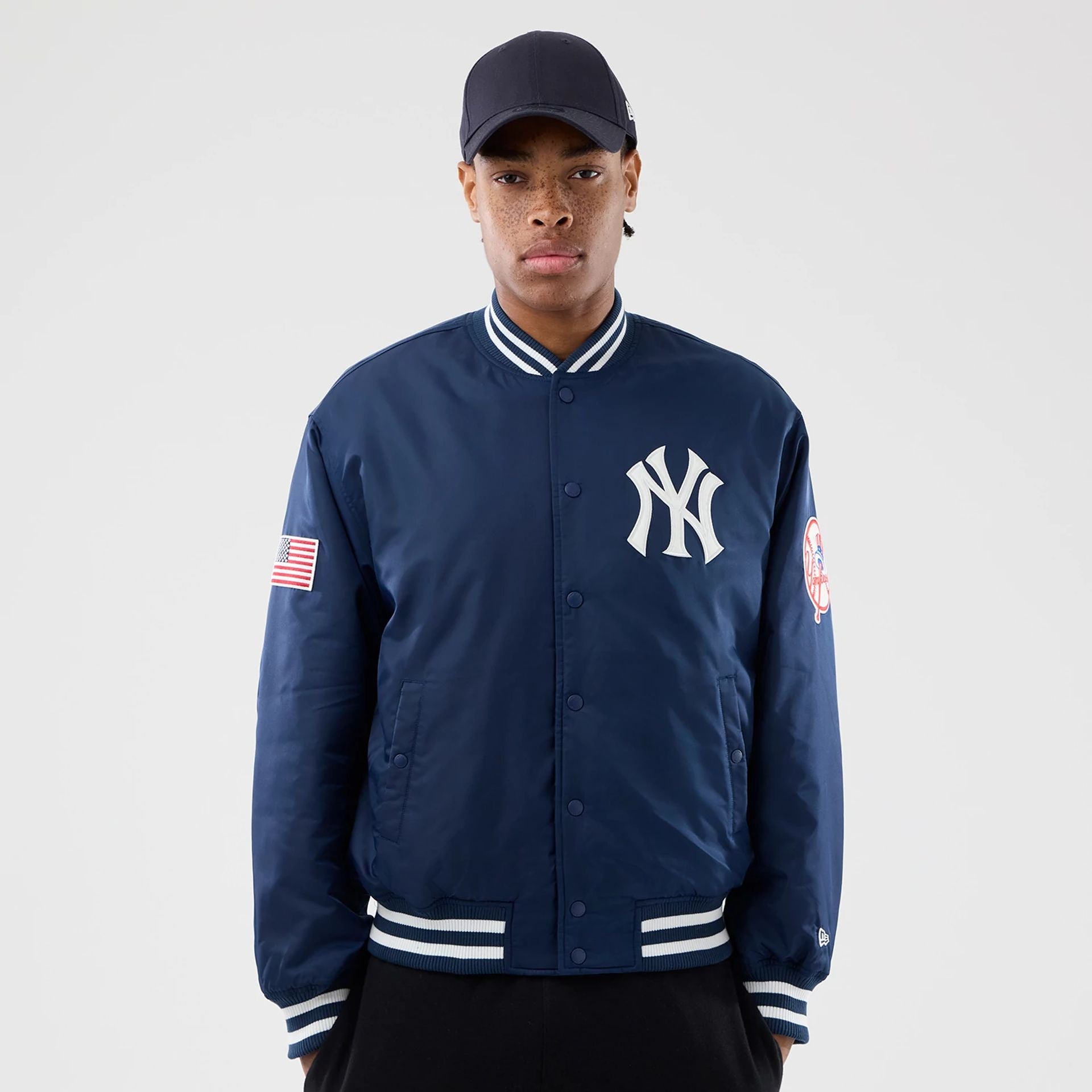 The Male model is wearing New York Yankees MLB Authentic Navy Stadium Jacket 1