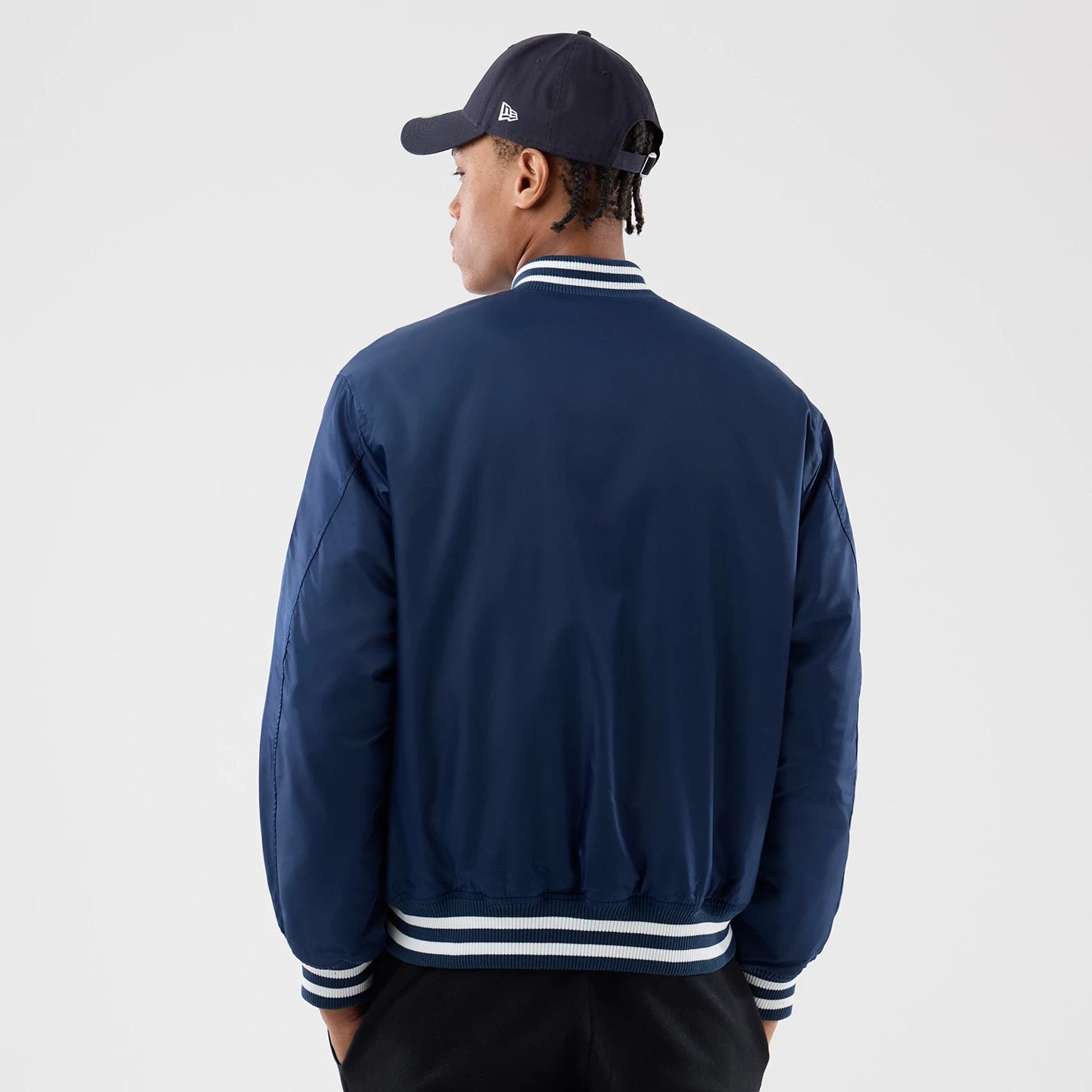 The Male model is wearing New York Yankees MLB Authentic Navy Stadium Jacket 2