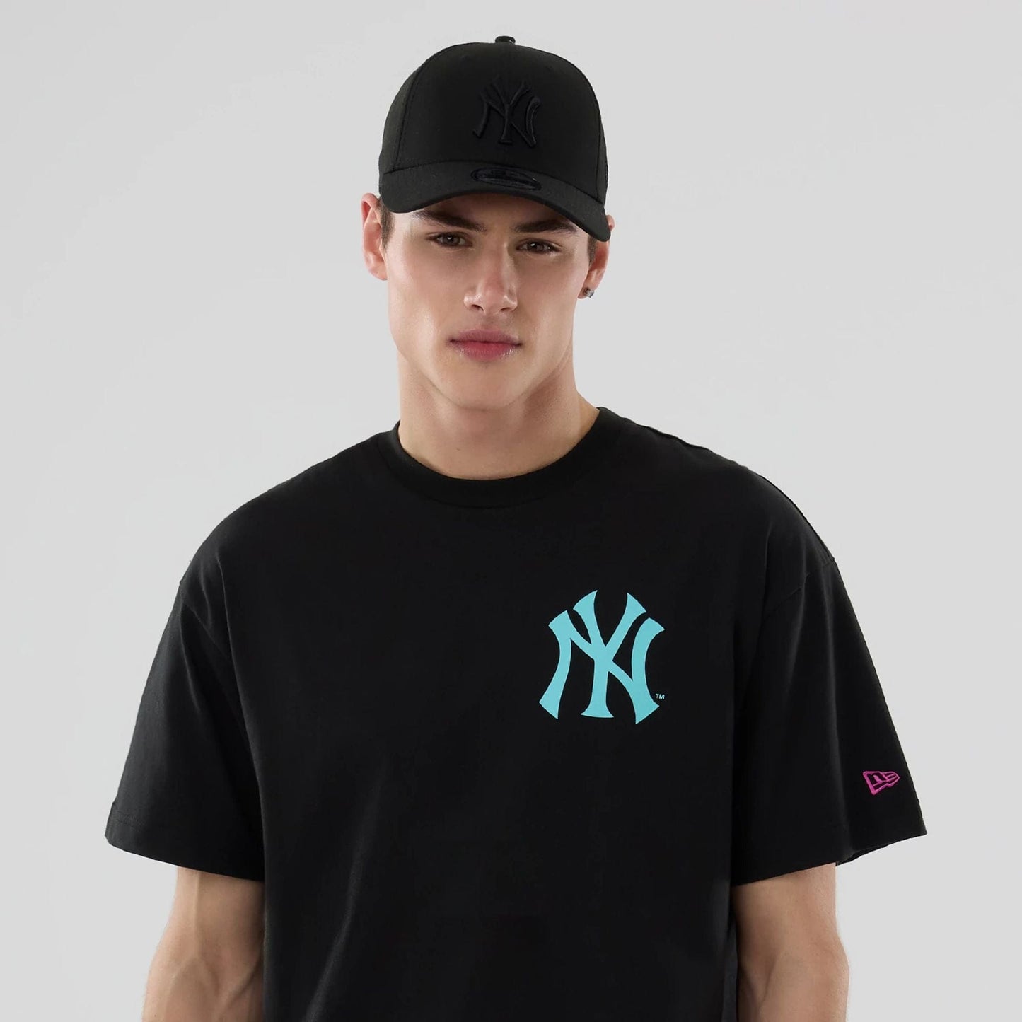 The model is wearing this MLB Neon Light New York Yankees T-Shirt in black. 7