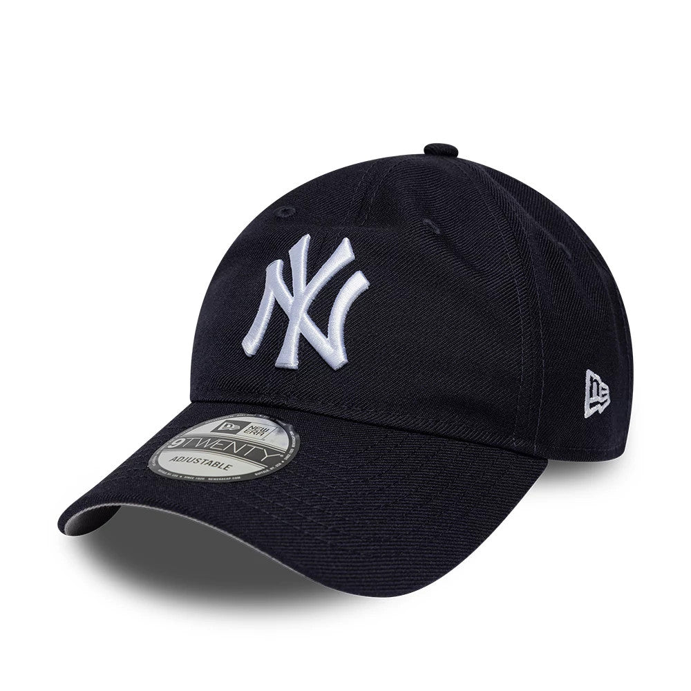 New York Yankees MLB Wool Navy New Era 9TWENTY Adjustable Cap, three-quarter view showing a raised white NY logo on the front panel, a curved visor with a 9TWENTY size sticker, and the New Era flag logo on the left side.