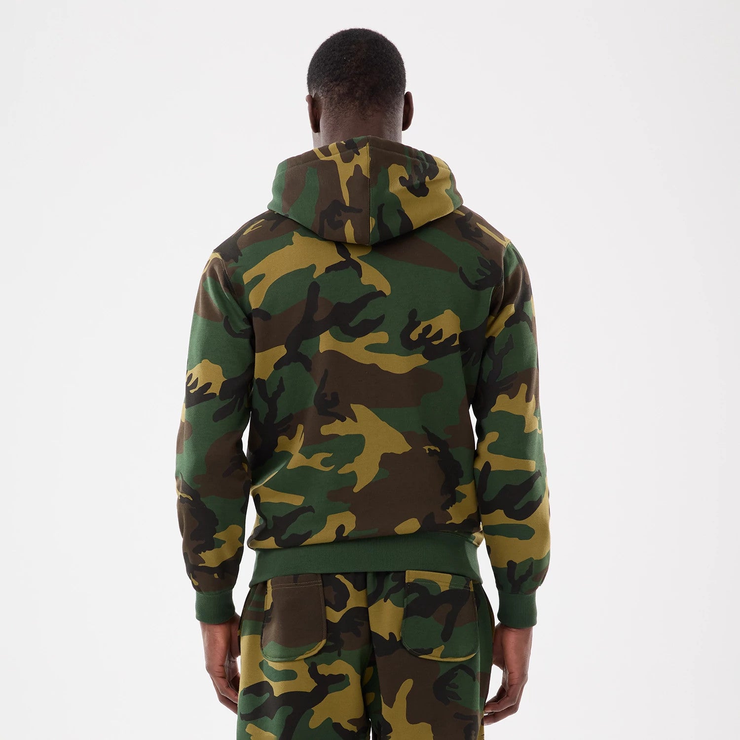 New York Yankees MLB Woodland Camo 2 Way Full Zip Hoodie, rear view showing the green and brown camouflage pattern across the hood and sleeves, ribbed cuffs at the wrists, and the back of the hoodie extending to the waistband.