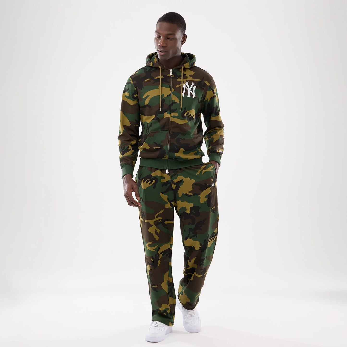 The model is wearing this New Era Woodland Camo Joggers in Woodland Camo. 8