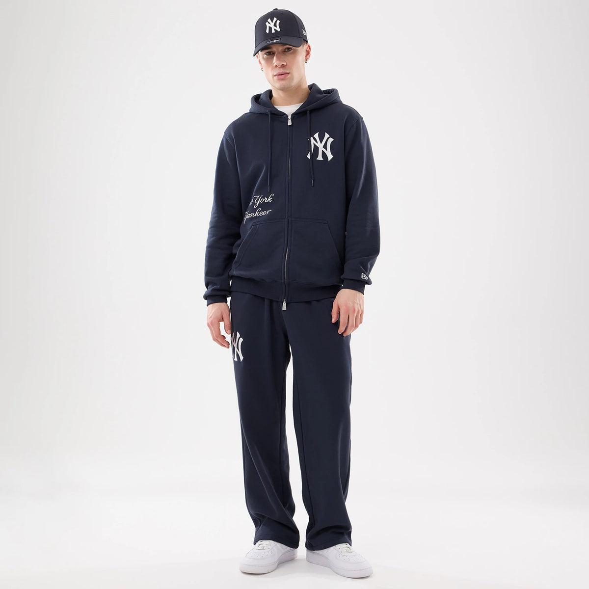 The model is wearing this MLB Comfort New York Yankees Joggers in blue. 8