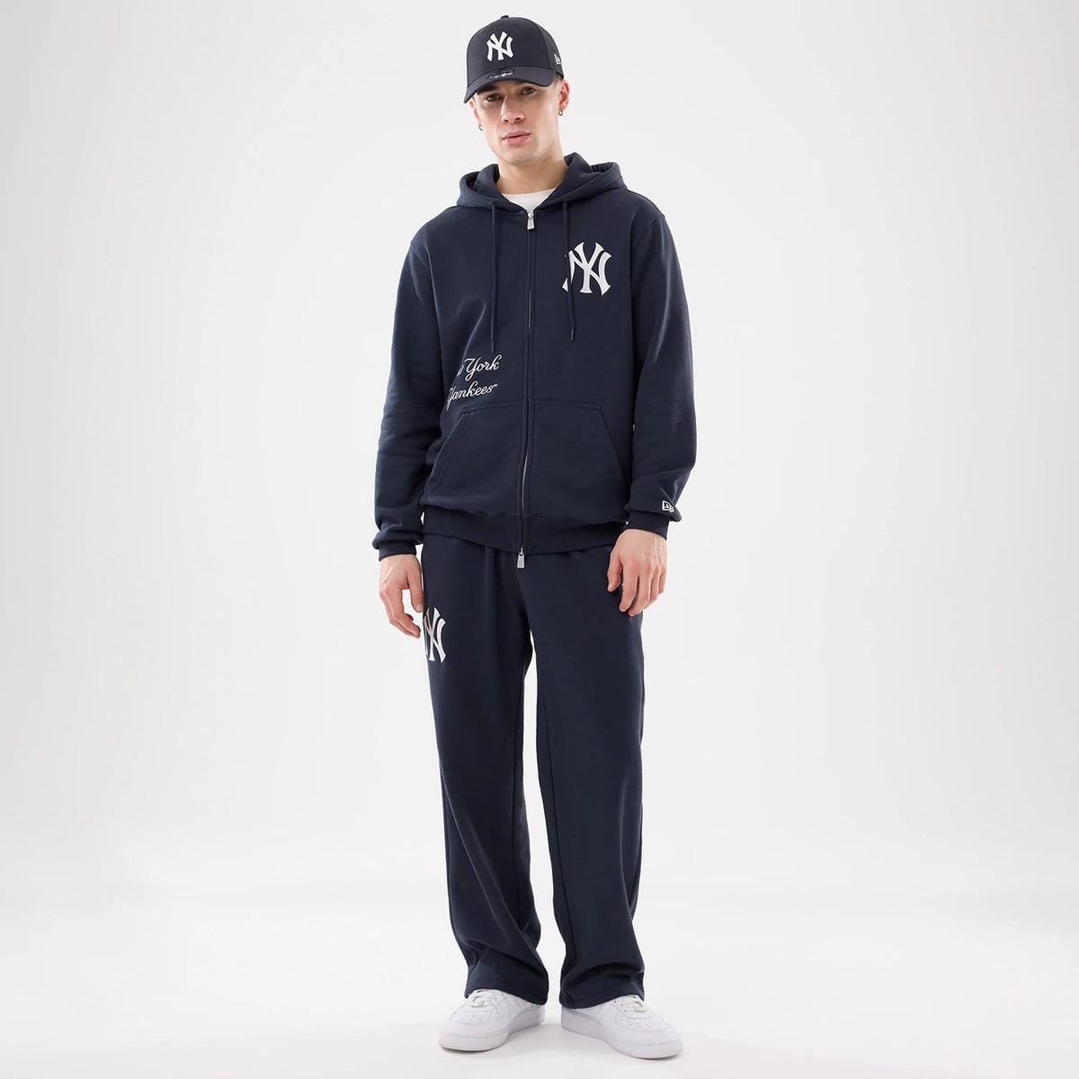 The model is wearing this MLB Comfort New York Yankees Joggers in blue. 8