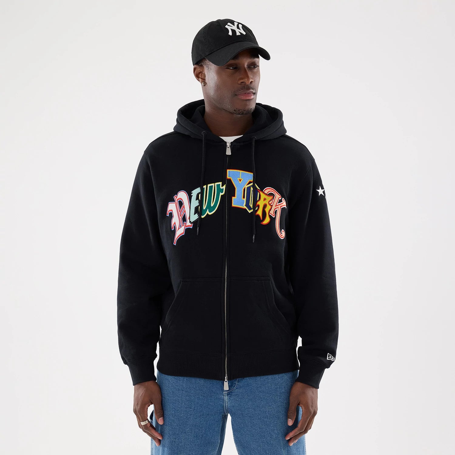 The model is wearing this MLB Word Art New York Yankees 2 Way Full Zip Hoodie in black. 1