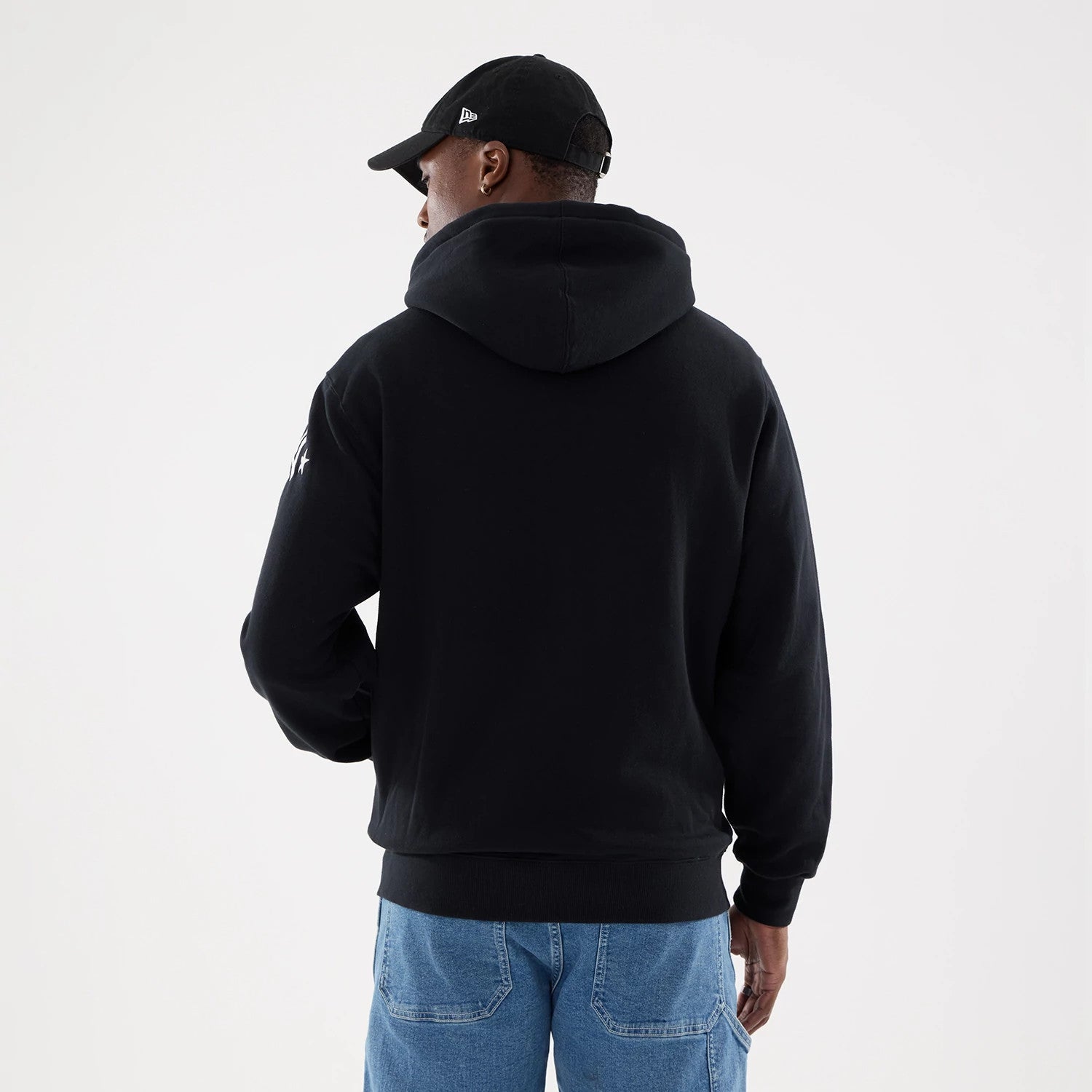 The model is wearing this MLB Word Art New York Yankees 2 Way Full Zip Hoodie in black. 2
