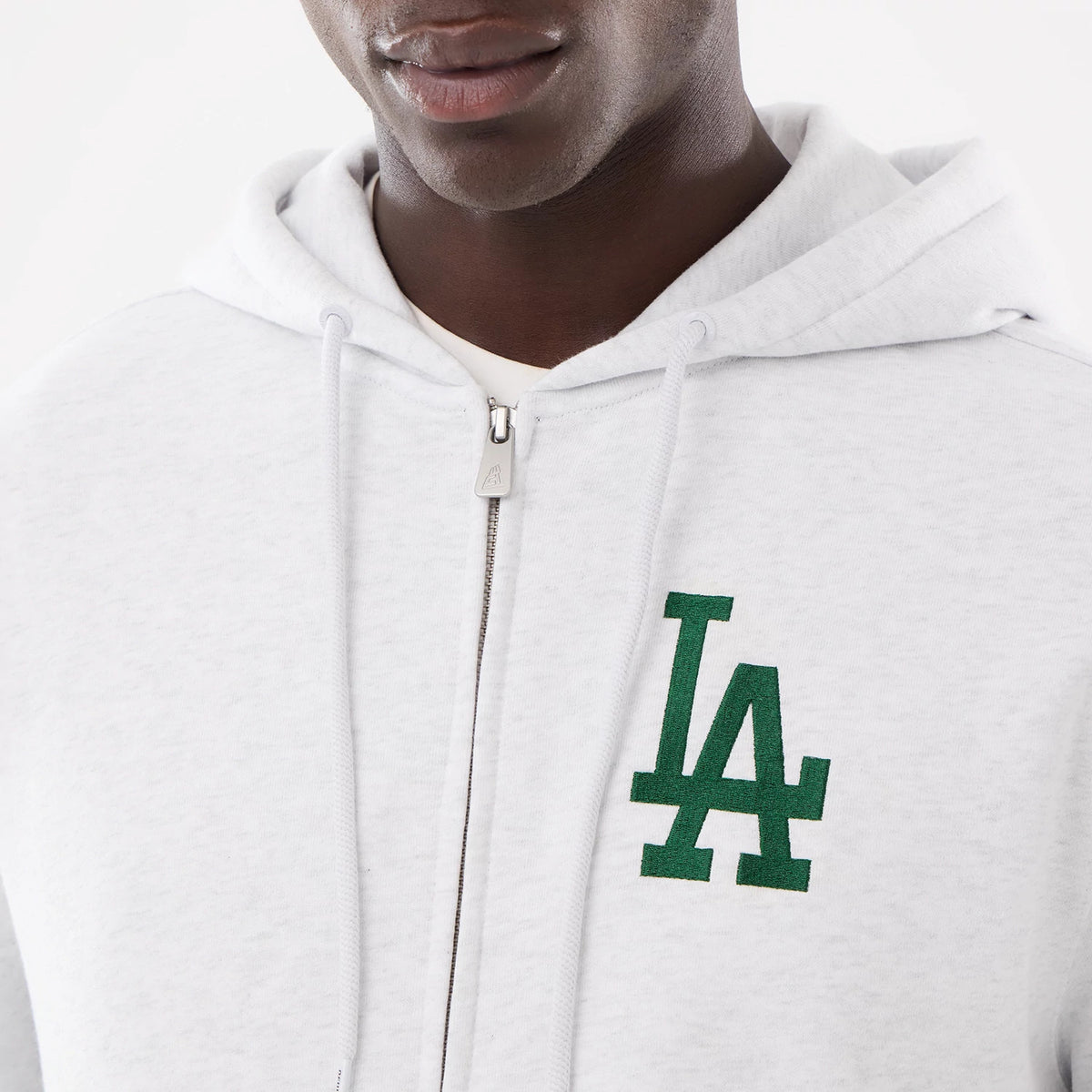 LA Dodgers MLB Comfort Grey 2 Way Full Zip Hoodie, front view showing a green embossed LA logo on the left chest, a full zip closure down the centre, and drawstrings at the base of the hood.