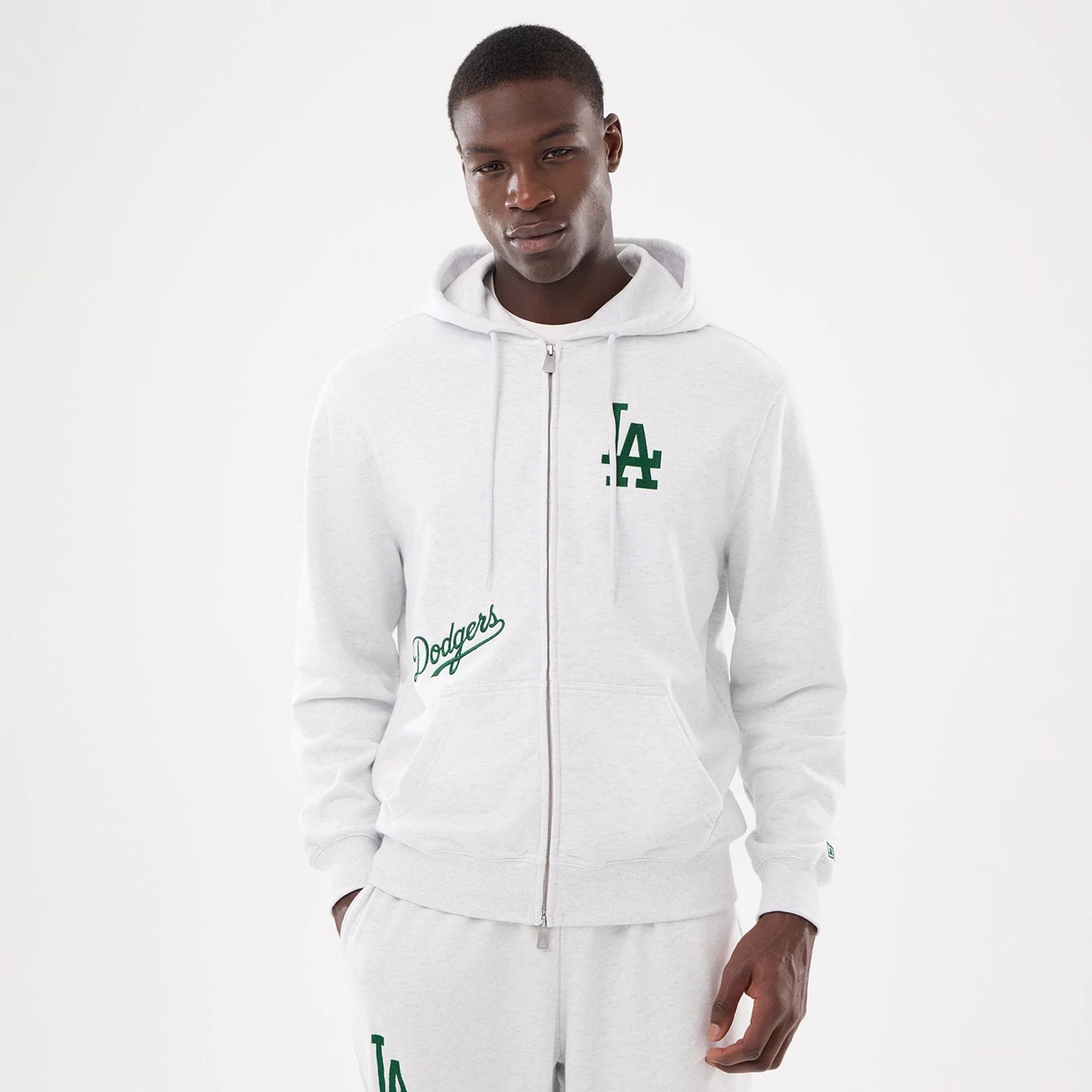 The model is wearing this MLB Comfort LA Dodgers 2 Way Full Zip Hoodie in grey. 1