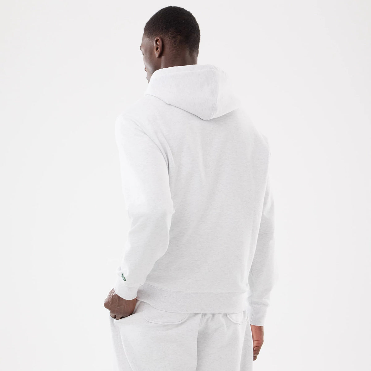LA Dodgers MLB Comfort Grey 2 Way Full Zip Hoodie, rear view showing the light grey hood and back panel of the hoodie, with a small debossed logo on the left sleeve above the cuff.