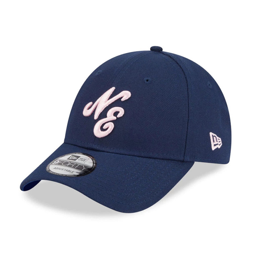 New Era Sakura Dark Blue New Era 9FORTY Adjustable Cap, three-quarter view showing pink raised embroidery "NE" on the front panel, with a matching pink New Era flag logo on the left side, and the 9FORTY size sticker on the visor.