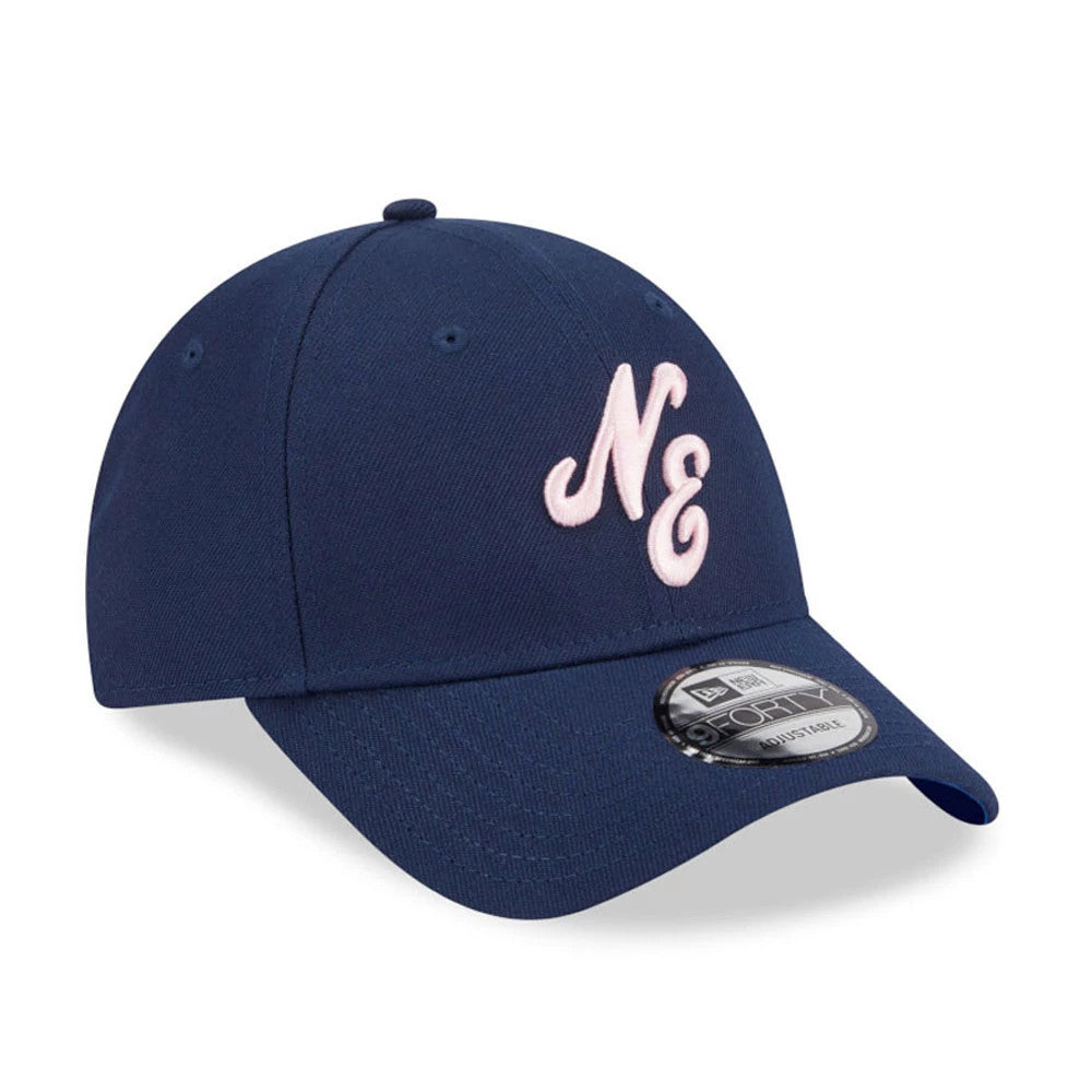 New Era Sakura Dark Blue 9FORTY Adjustable Cap, three-quarter view showing the pink embroidered NE logo on the front panel, with a curved visor and a 9FORTY size sticker on the top of the visor.