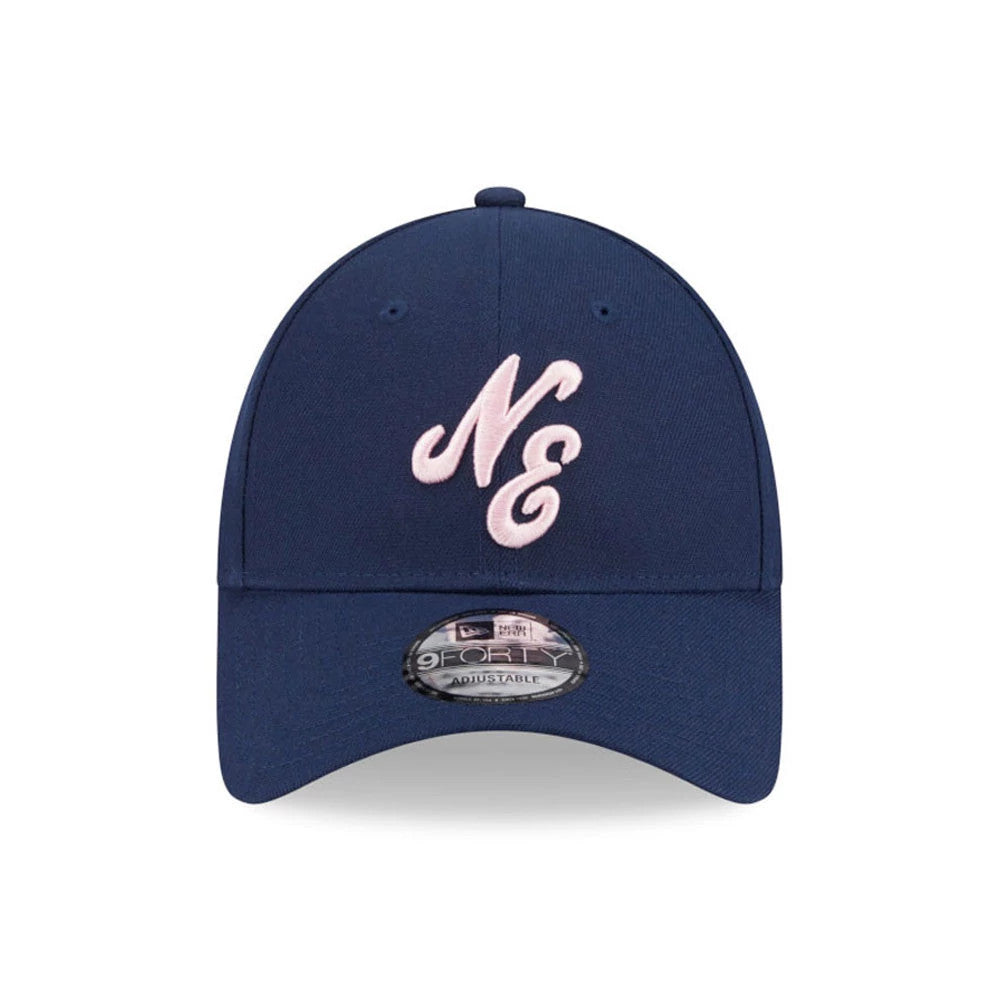 New Era Sakura Dark Blue 9FORTY Adjustable Cap, front view with raised pink "NE" embroidery on the structured dark blue crown, featuring a curved visor and a 9FORTY size sticker centred on top.