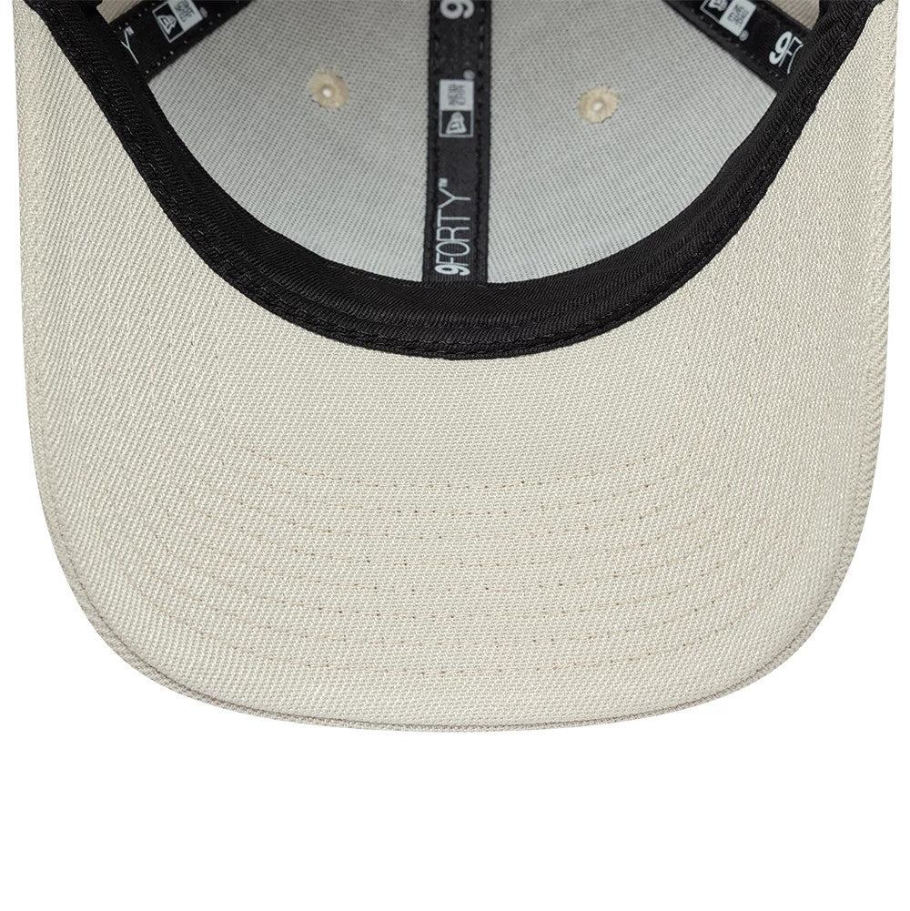 New Era Earth Day Beige 9FORTY Adjustable Cap, inside view showing the black sweatband and grey taping with logos, highlighting the beige undervisor and top button against the light fabric interior.