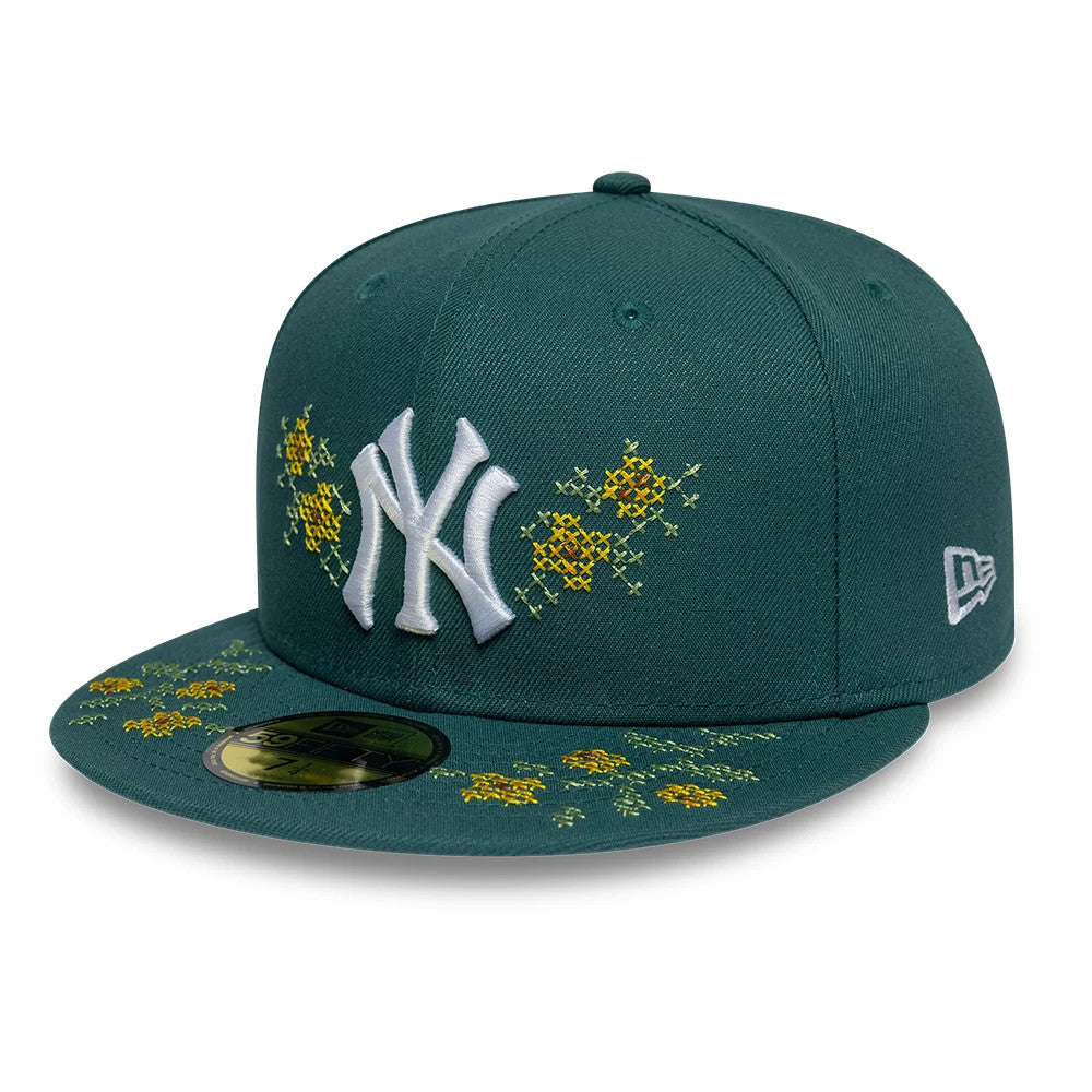 New York Yankees MLB Garden Dark Green New Era 59FIFTY Fitted Cap, three-quarter view showing the raised white NY logo on the front panel, yellow floral embroidery on the visor and crown, and the New Era flag logo on the left side.