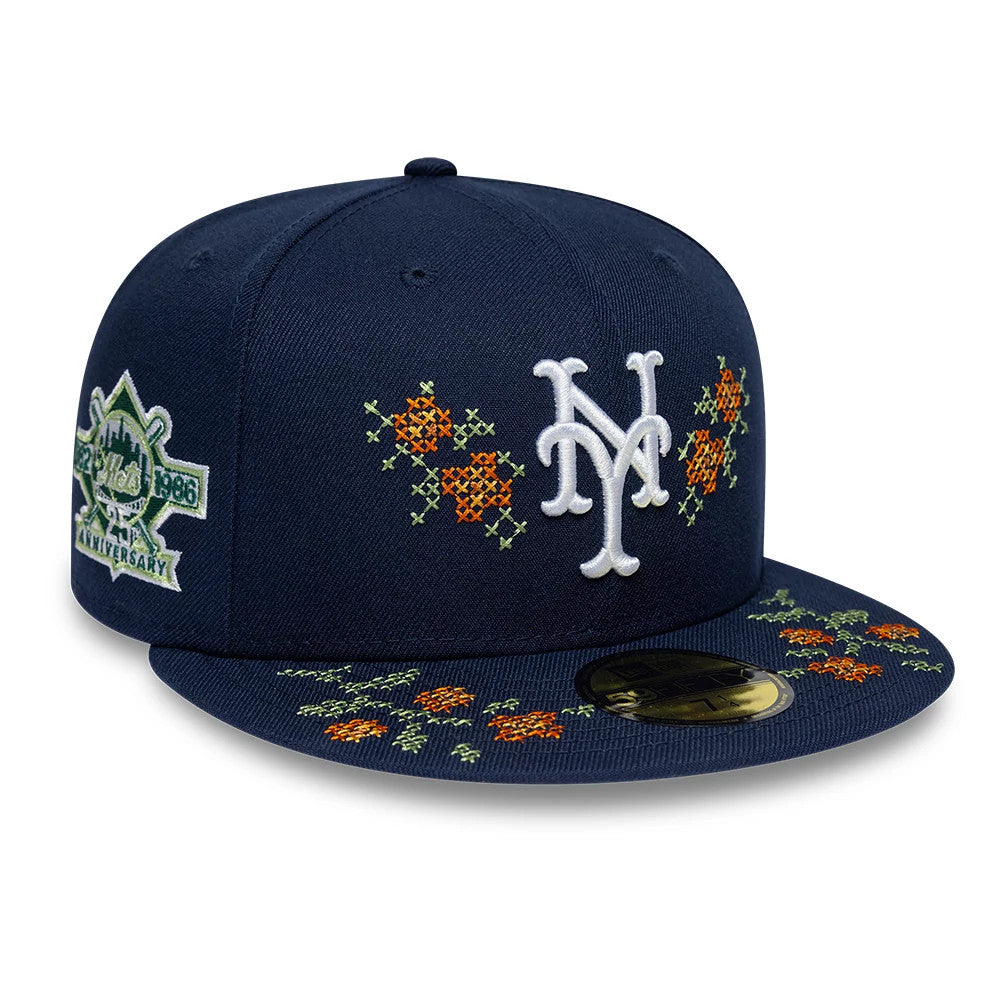New York Mets MLB Garden Dark Blue New Era 59FIFTY Fitted Cap, front view showing white NY logo with orange floral embroidery on the crown and visor, side panel featuring the 1986 Mets anniversary patch, gold 59FIFTY size sticker on the visor.
