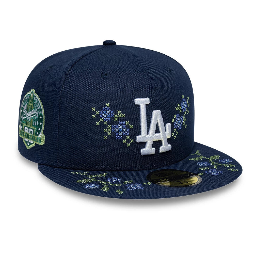 LA Dodgers MLB Garden Dark Blue New Era 59FIFTY Fitted Cap, front view with white LA logo on front panel, floral embroidery on crown and visor, and gold 59FIFTY size sticker on the visor.