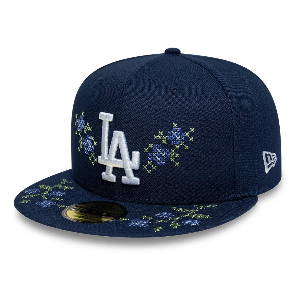 LA Dodgers MLB Garden Dark Blue New Era 59FIFTY Fitted Cap, front view with white raised embroidered LA logo on the front panel, floral embroidery on the visor and front, and the New Era flag logo on the left side.