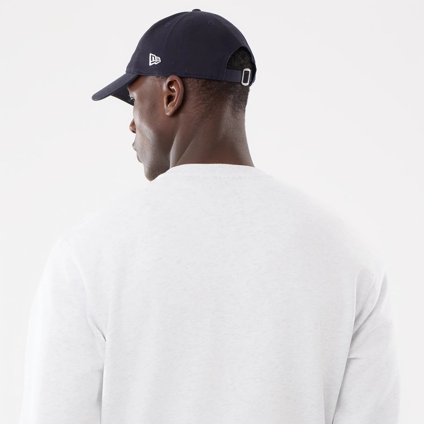 The model is wearing this MLB Retro New York Yankees Oversized Crew Neck Sweater in White 7