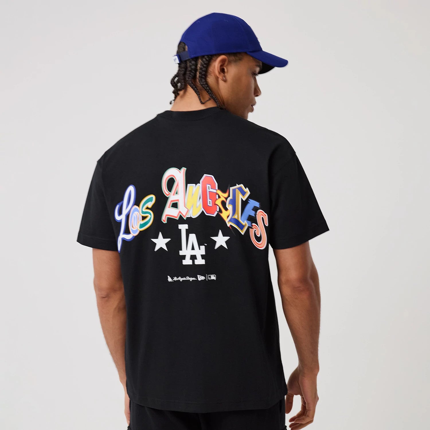 The model is wearing this MLB Word Art LA Dodgers T-Shirt in black. 2