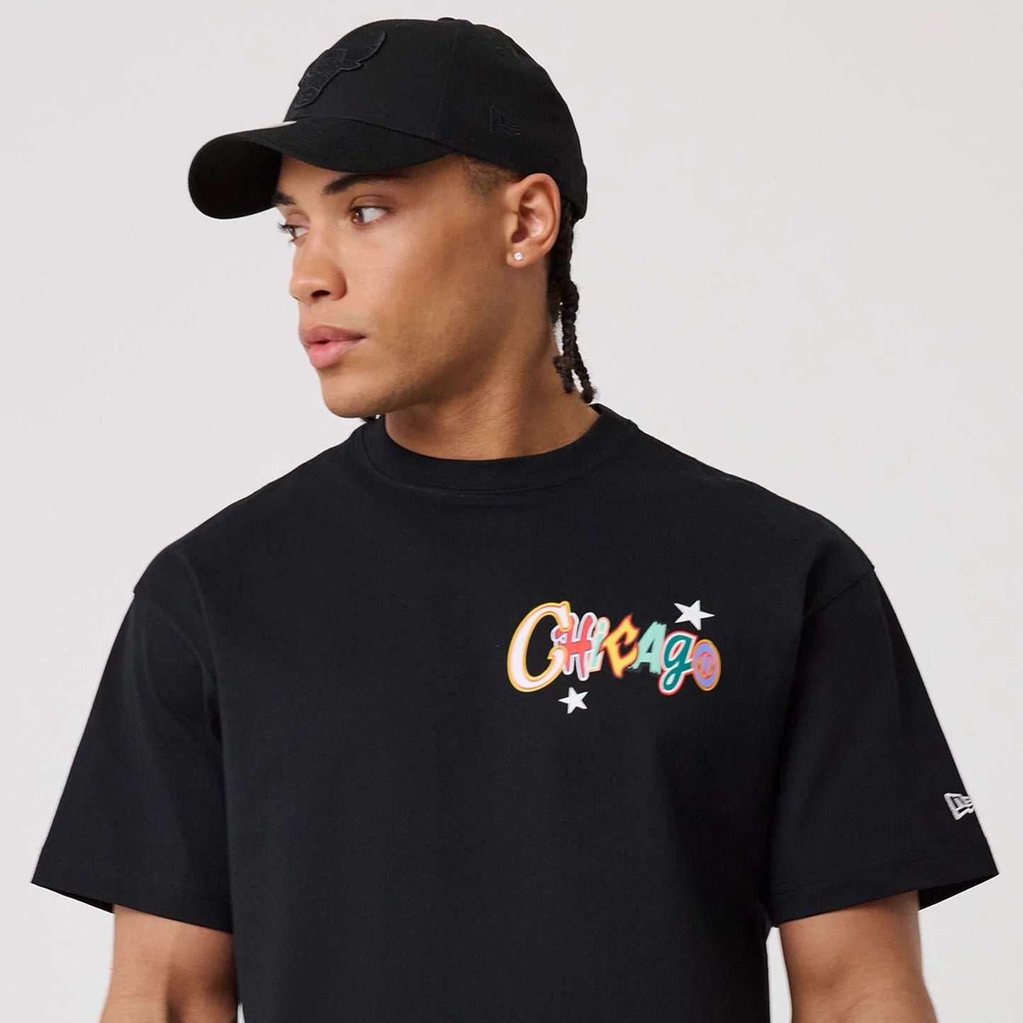 The model is wearing this MLB Word Art Chicago Bulls T-Shirt in black. 7