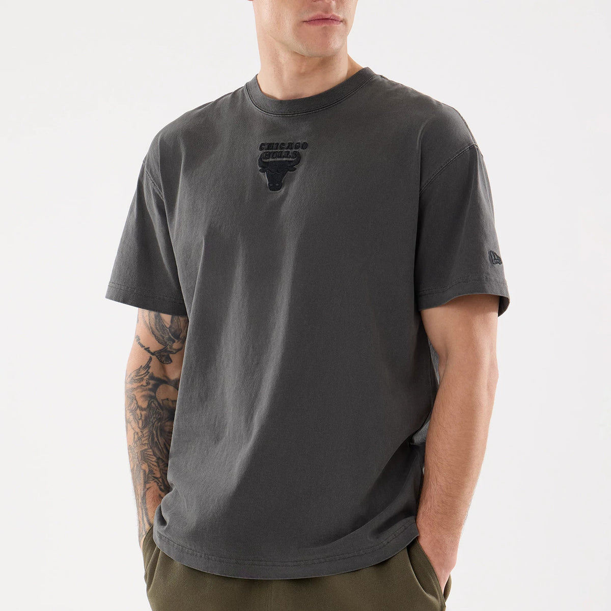 Chicago Bulls NBA Shadow Pop Black T-Shirt, front view showing a black embossed Bulls logo on the centre of the chest, short sleeves with a black embossed New Era logo near the left sleeve cuff.