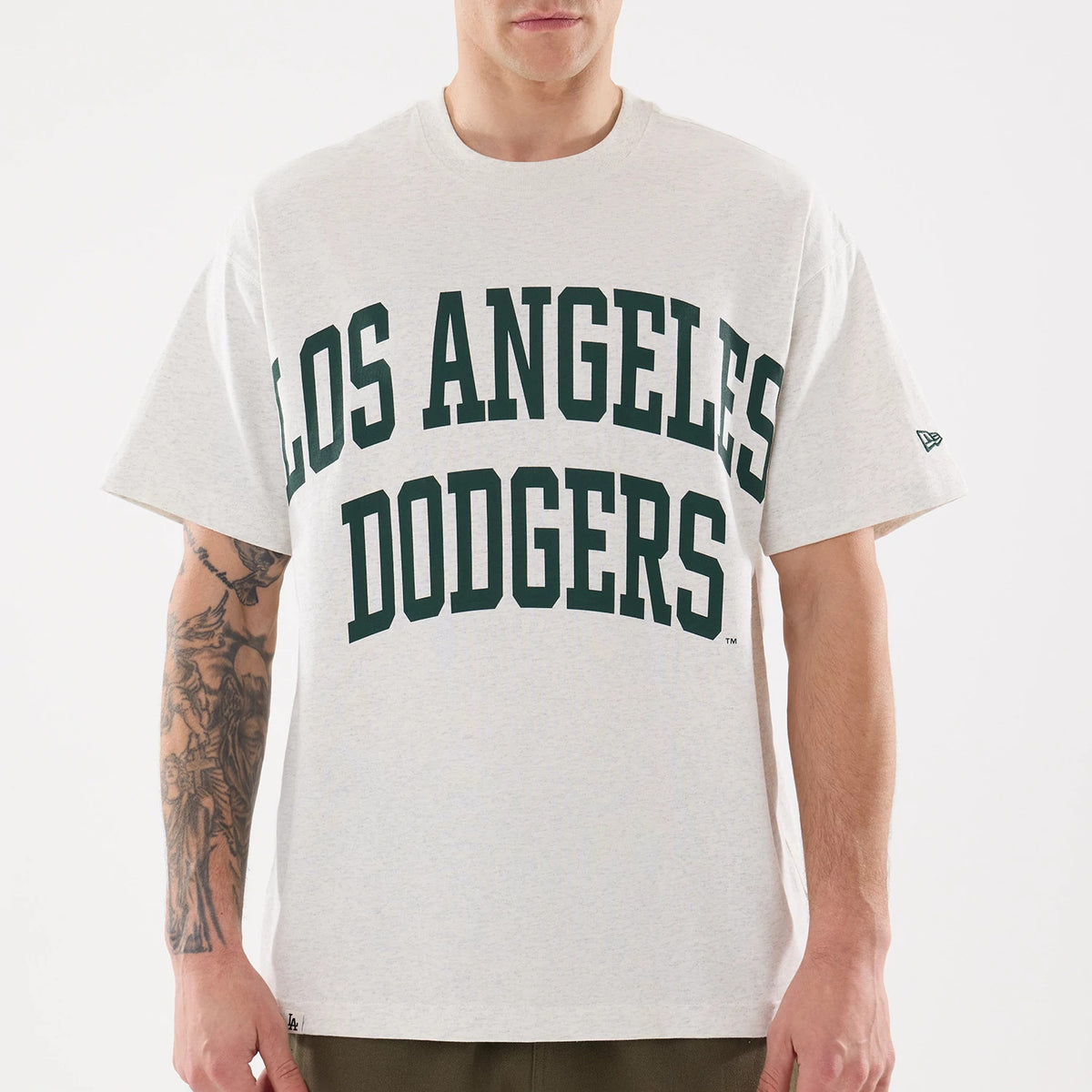 LA Dodgers MLB Comfort Grey T-Shirt, front view showing the bold green "Los Angeles Dodgers" text across the chest and a small embroidered New Era logo on the left sleeve against the light grey fabric.