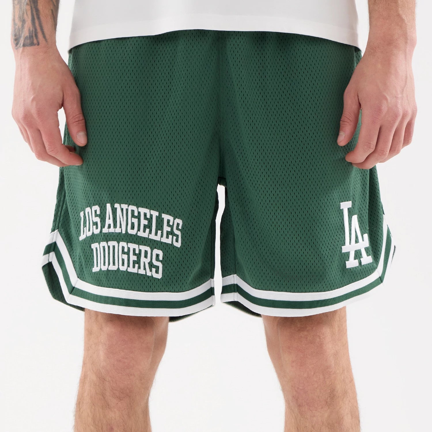 The model is wearing this MLB Comfort LA Dodgers Oversized Shorts in Dark Green. 3