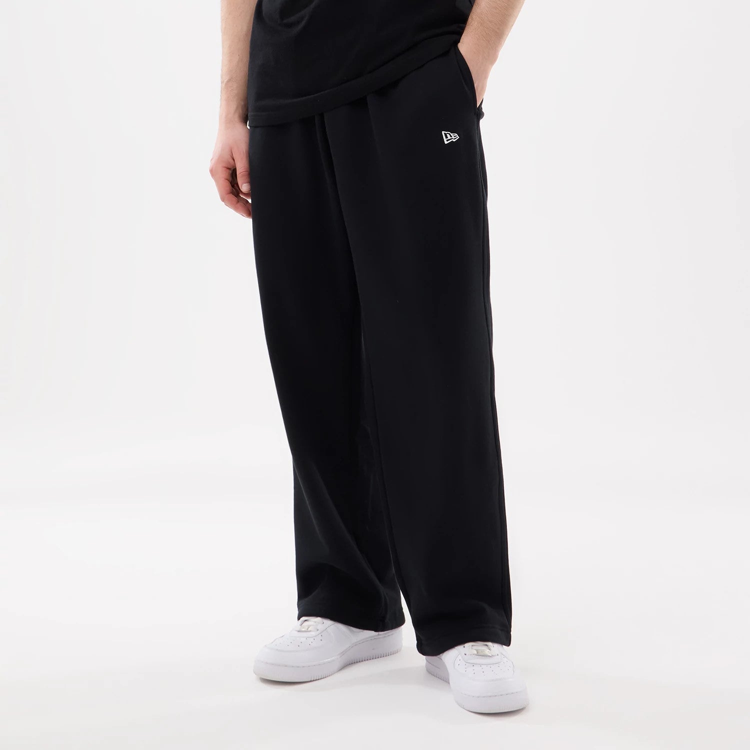 The model is wearing this New Era Straight Legged Joggers in black. 1