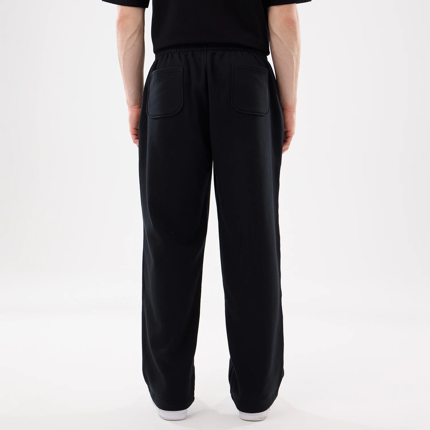 The model is wearing this New Era Straight Legged Joggers in black. 2