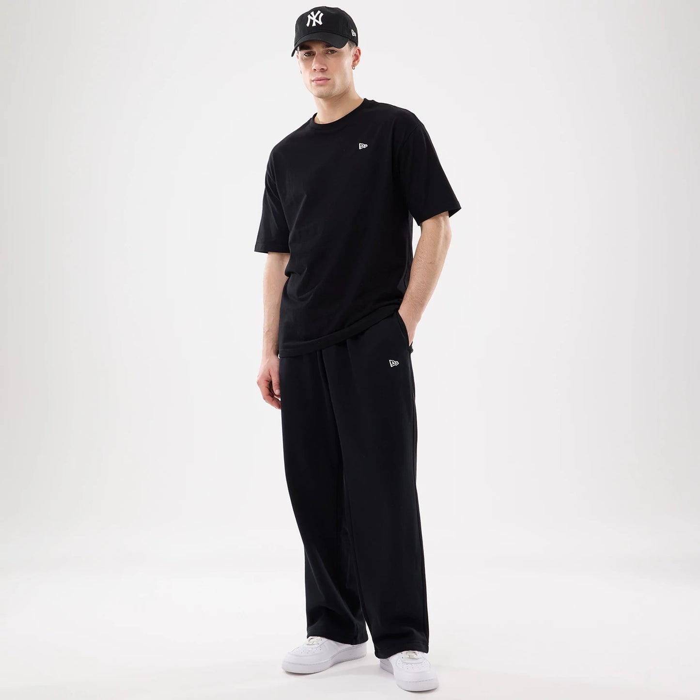 The model is wearing this New Era Straight Legged Joggers in black. 7