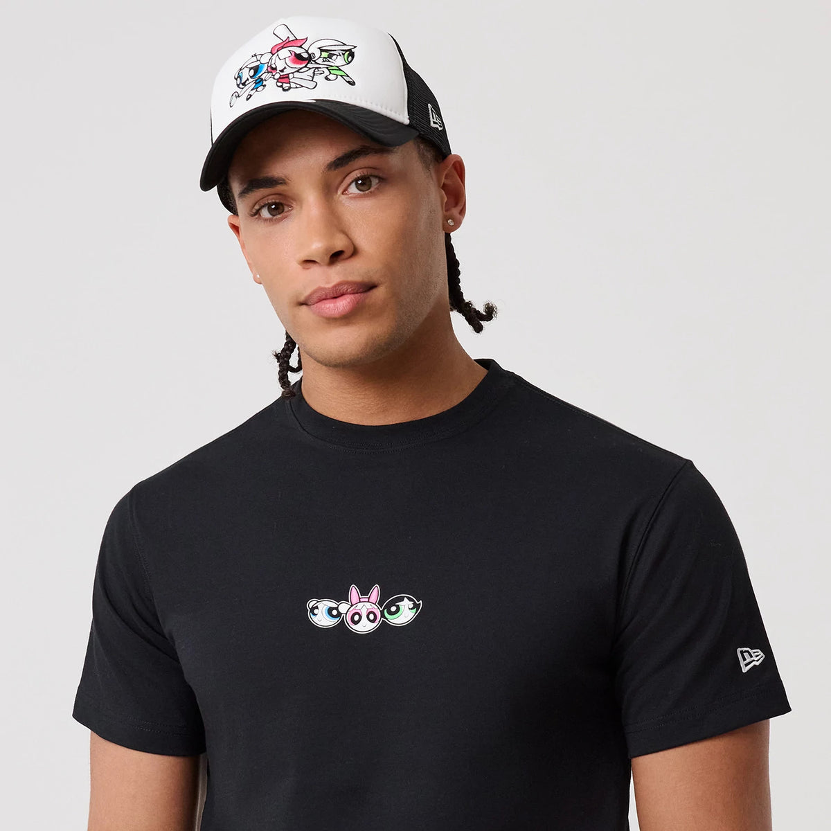 Powerpuff Girls Powerpuff Girls Black T-Shirt, on-model view showing the embroidered Powerpuff Girls logo centred on the chest, short sleeves with a small New Era logo on the left sleeve, plain black fabric.