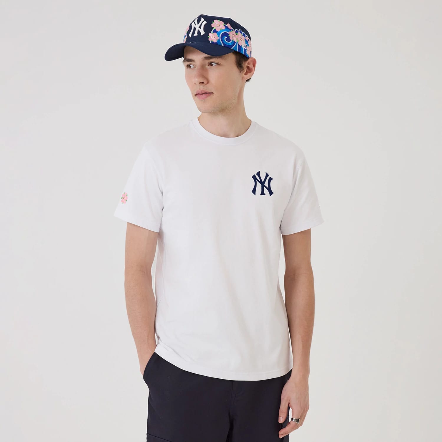 The model is wearing this MLB Sakura New York Yankees T-Shirt in white. 1