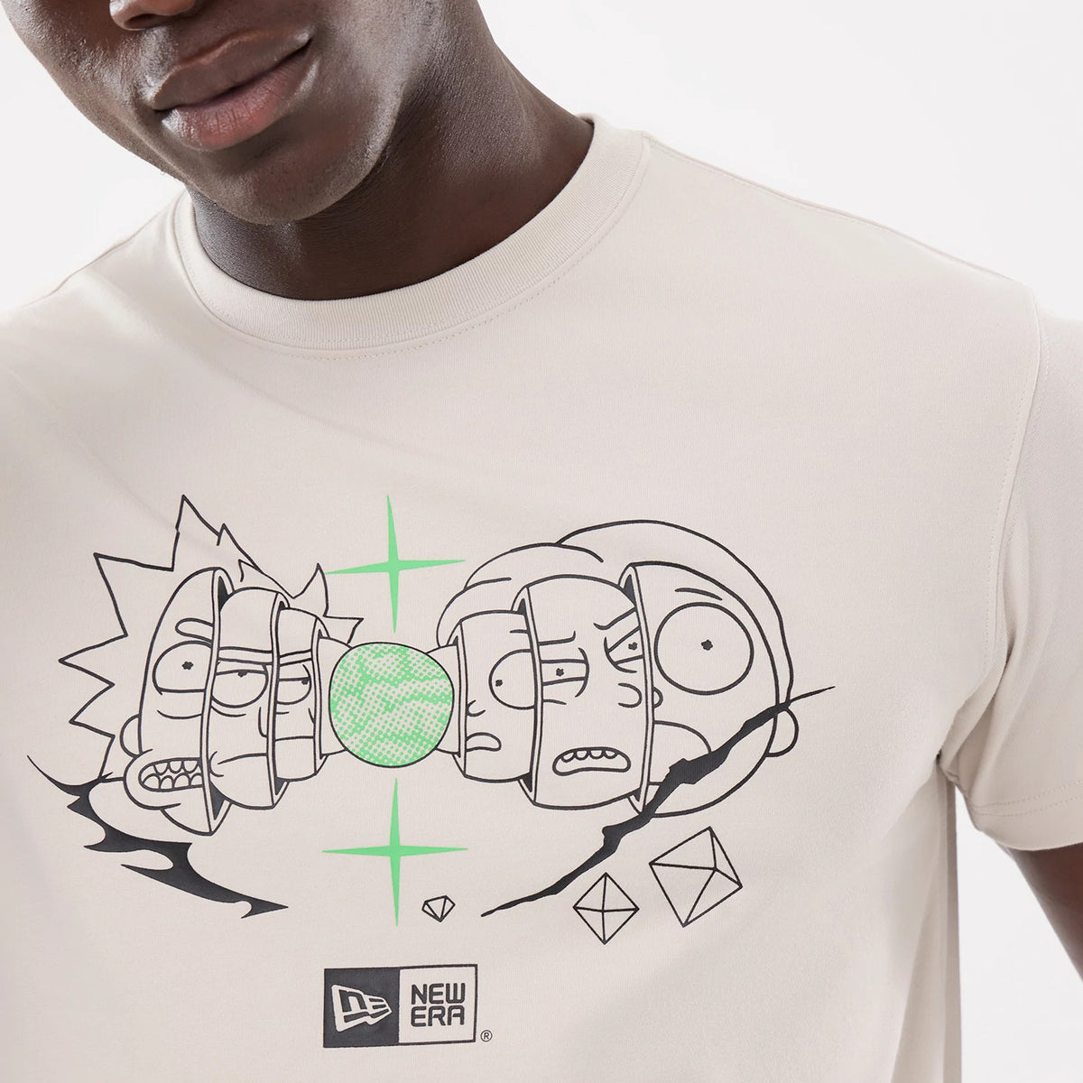Rick And Morty Character Stack Cream T-Shirt, on-model view showing the cream shirt with black and green character graphics on the front, a black New Era logo at the bottom centre of the design.