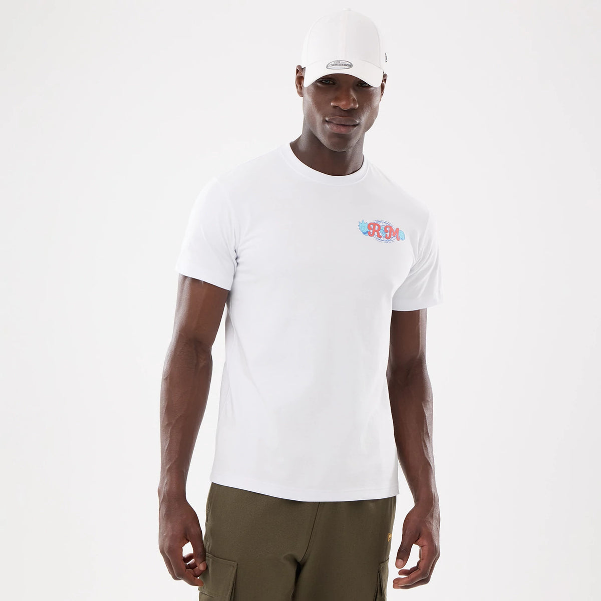 Rick And Morty White T-Shirt, on-model view showing a clean white T-shirt with a small, colourful logo printed on the left chest, paired with an all-white cap featuring a debossed logo on the front.