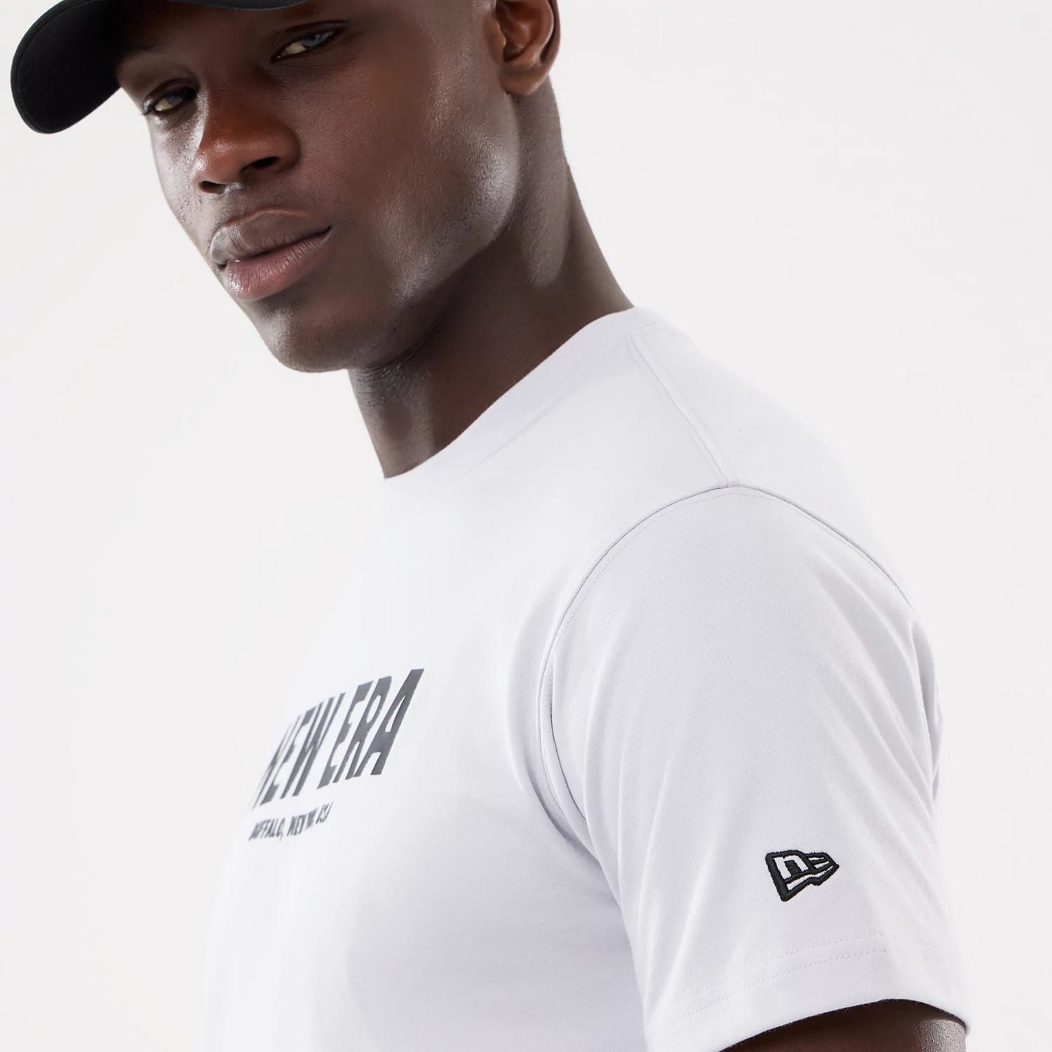 The model is wearing this New Era Basic T-Shirt in white. 4
