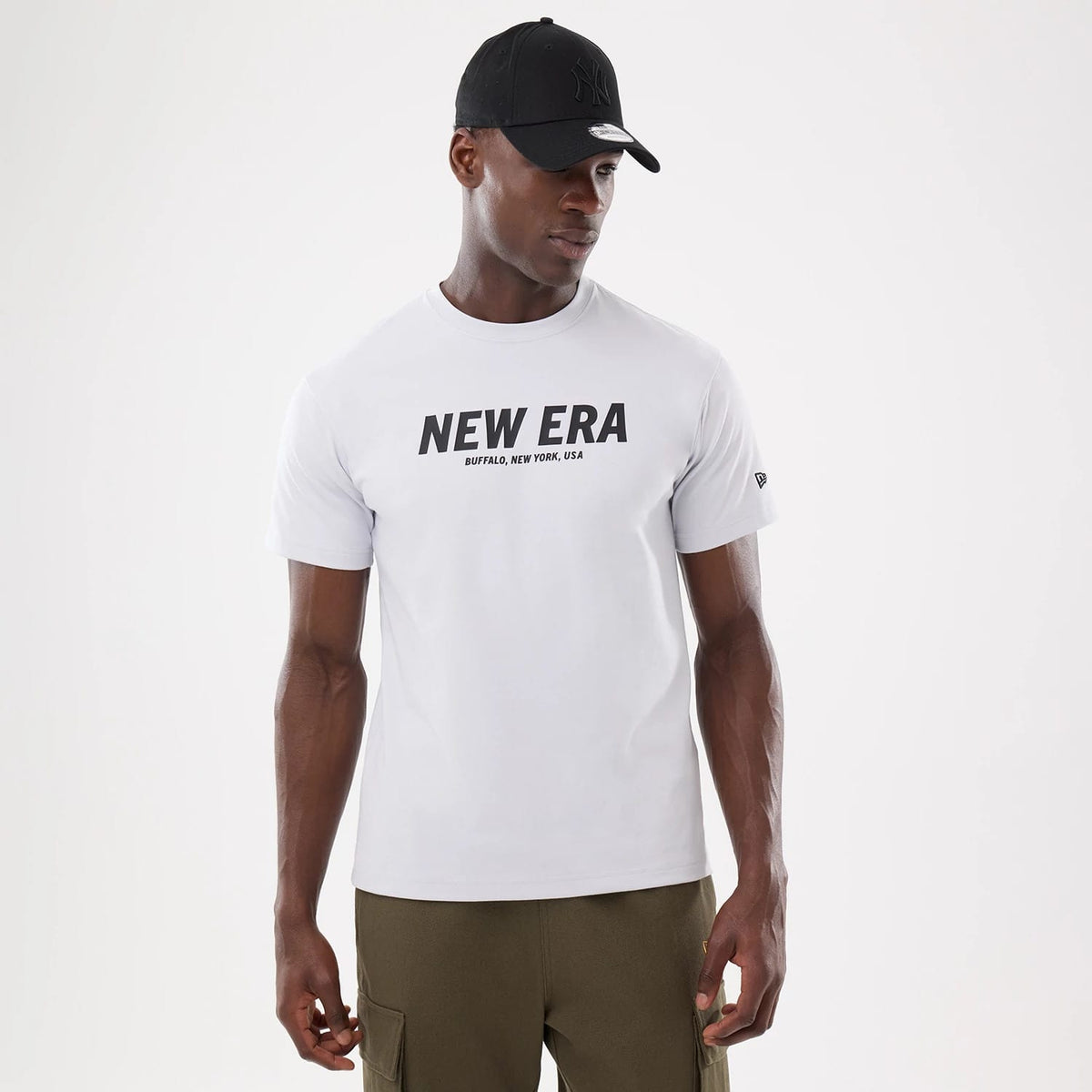 The model is wearing this New Era Basic T-Shirt in white. 1