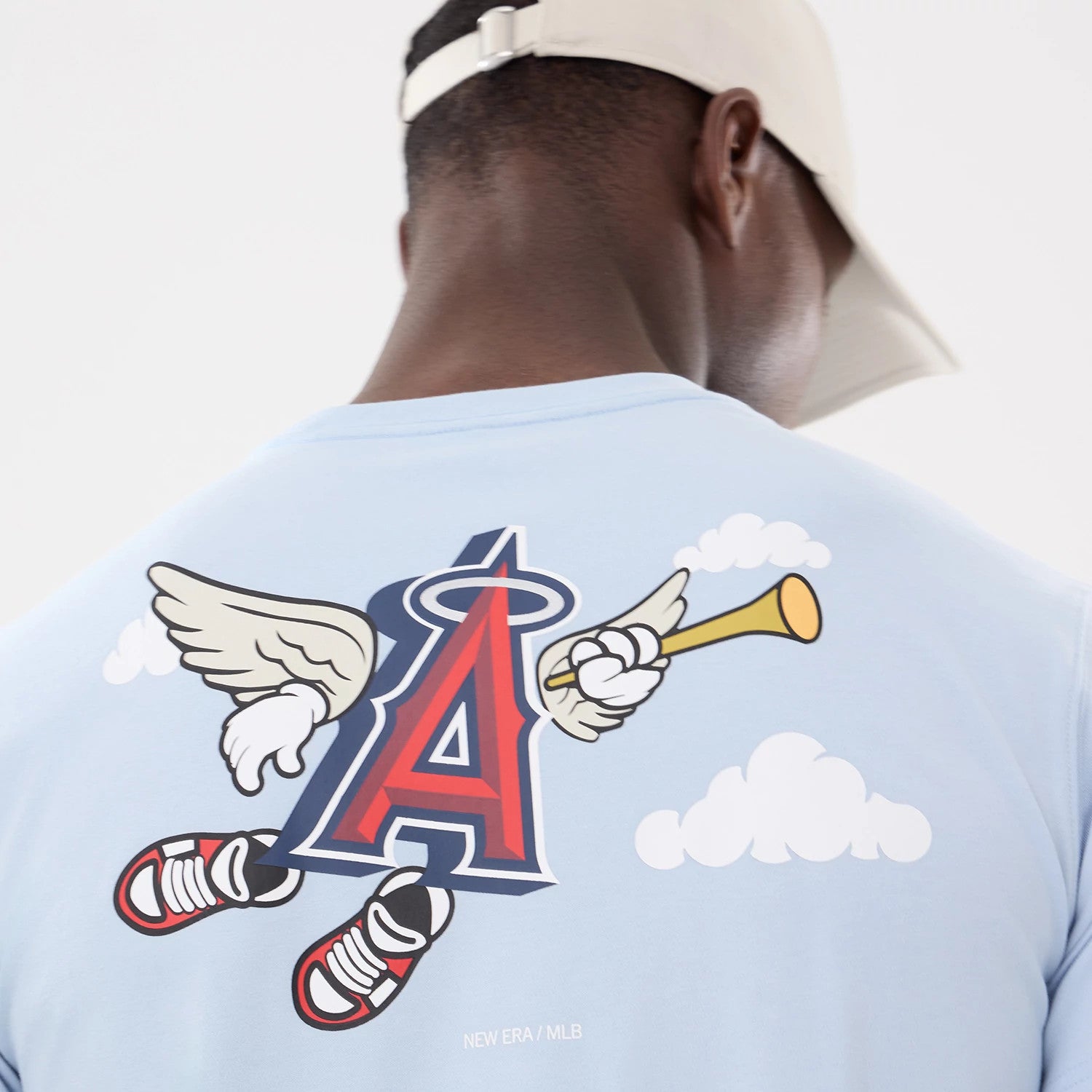 The model is wearing this MLB Cartoon LA Angels T-Shirt in blue. 4