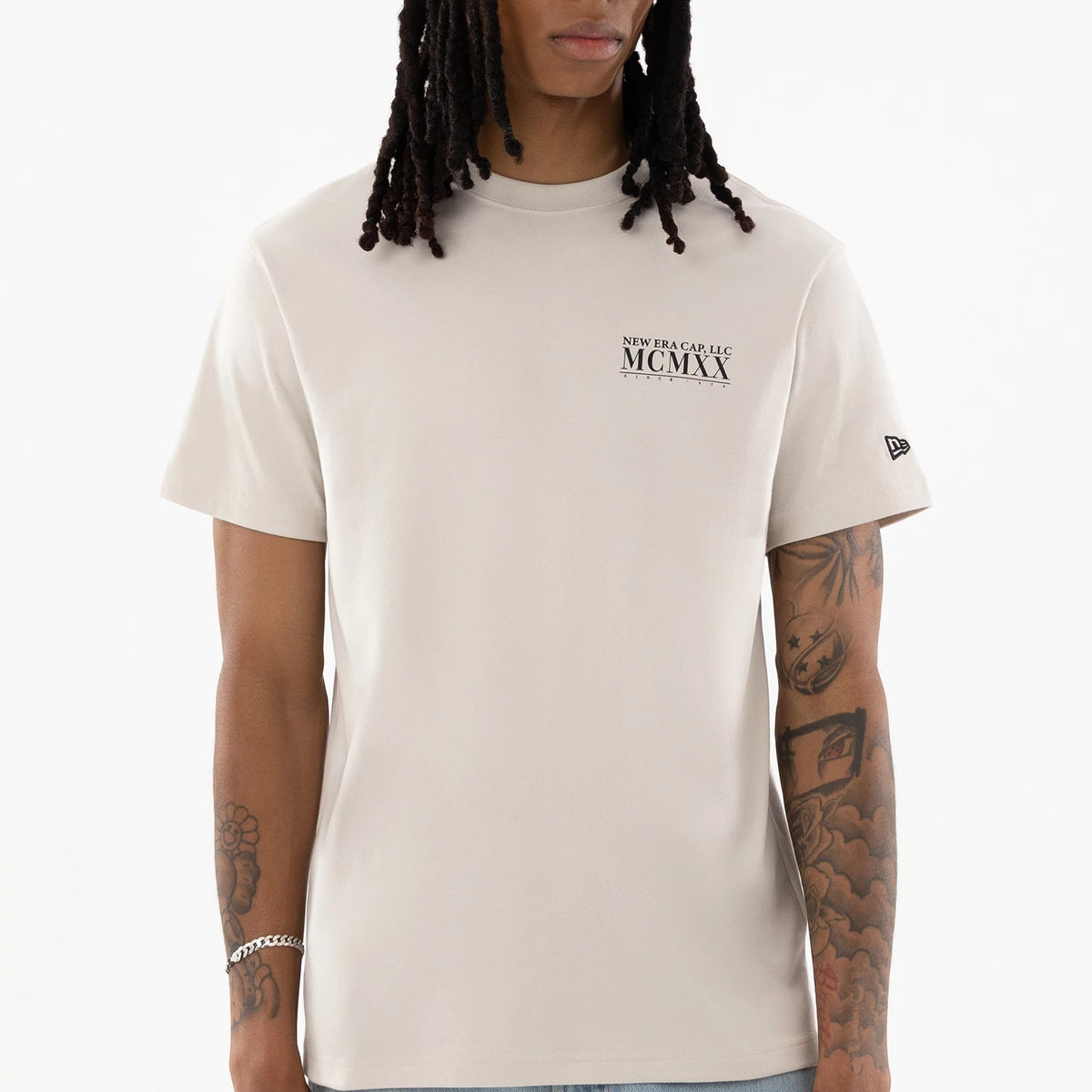 The model is wearing this New Era Heritage T-Shirt in Cream. 4